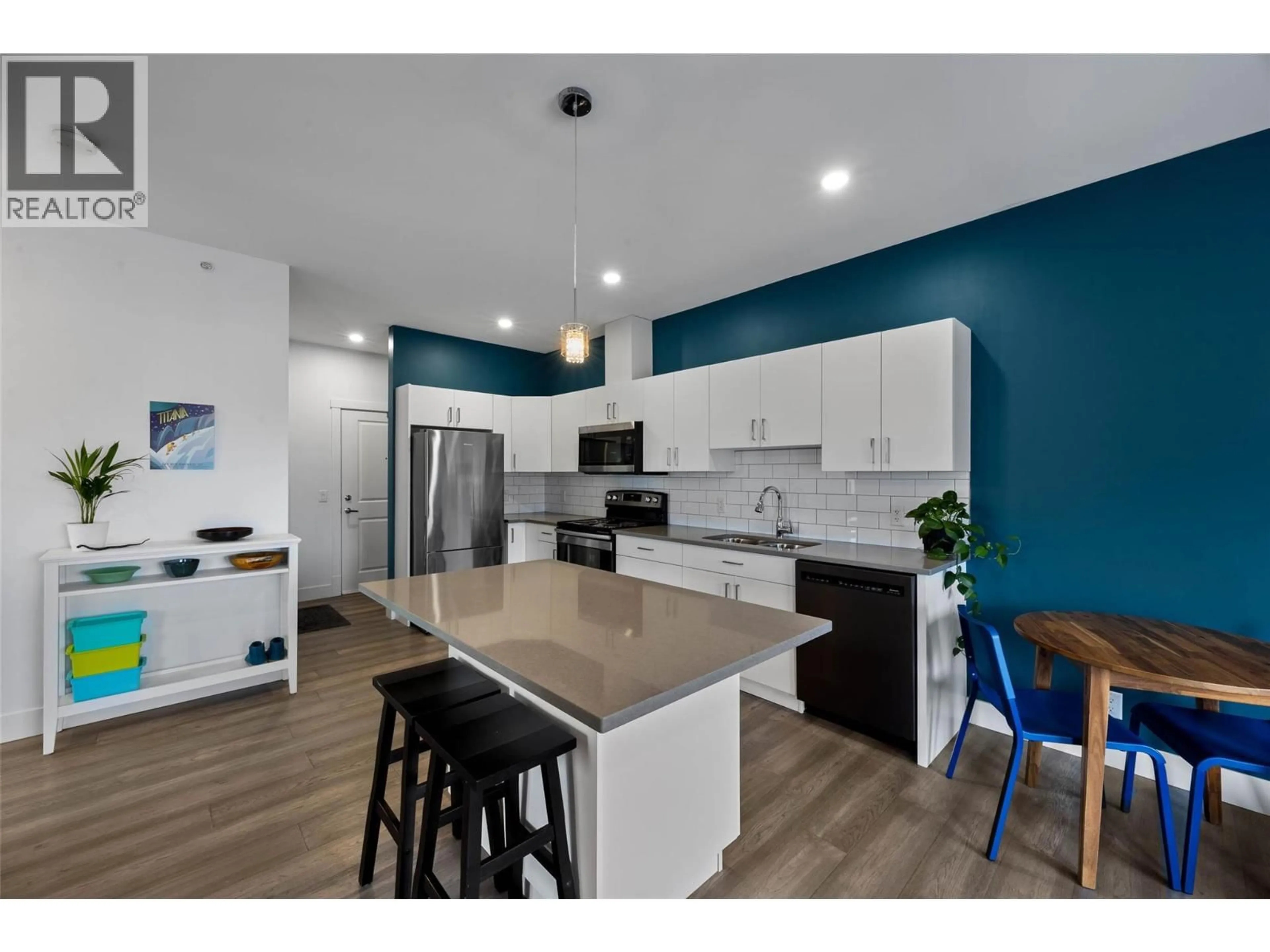 Open concept kitchen, wood/laminate floor for 404 - 777 BATTLE STREET, Kamloops British Columbia V2C2M6