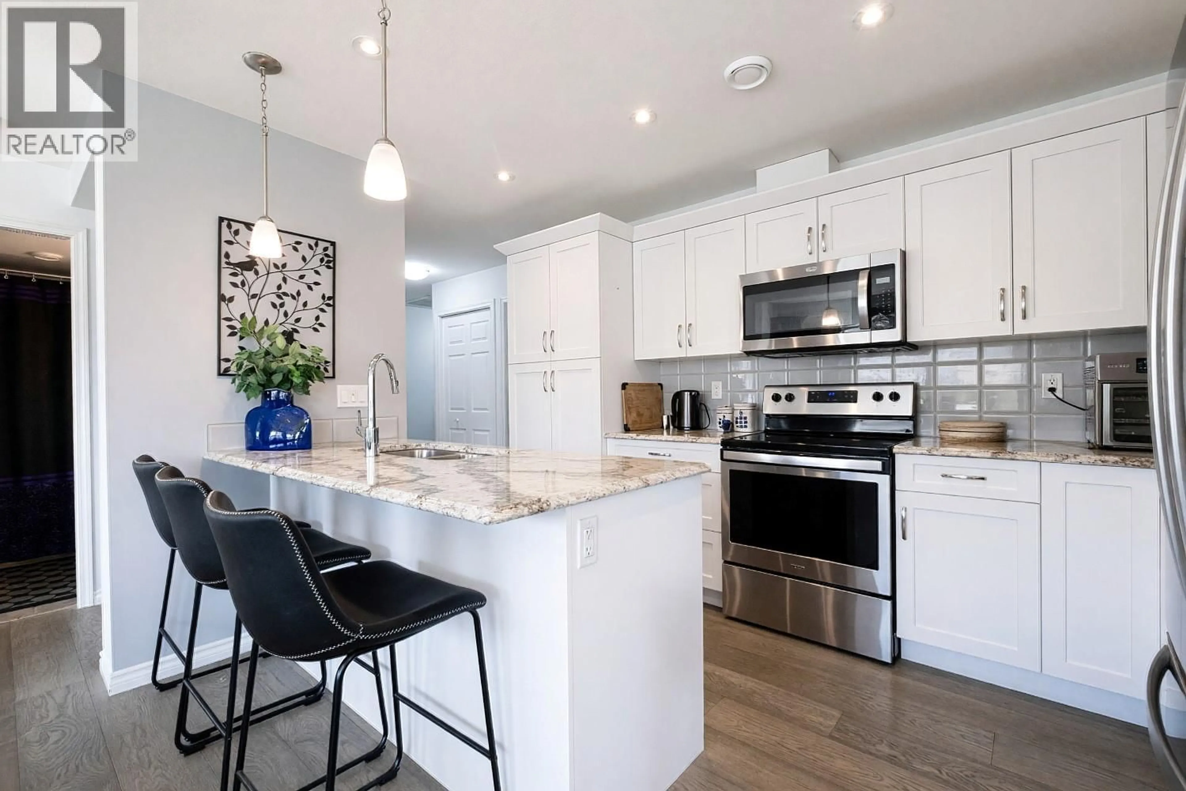 Open concept kitchen, ceramic/tile floor for 705 - 3388 SKAHA LAKE ROAD, Penticton British Columbia V2A6G4