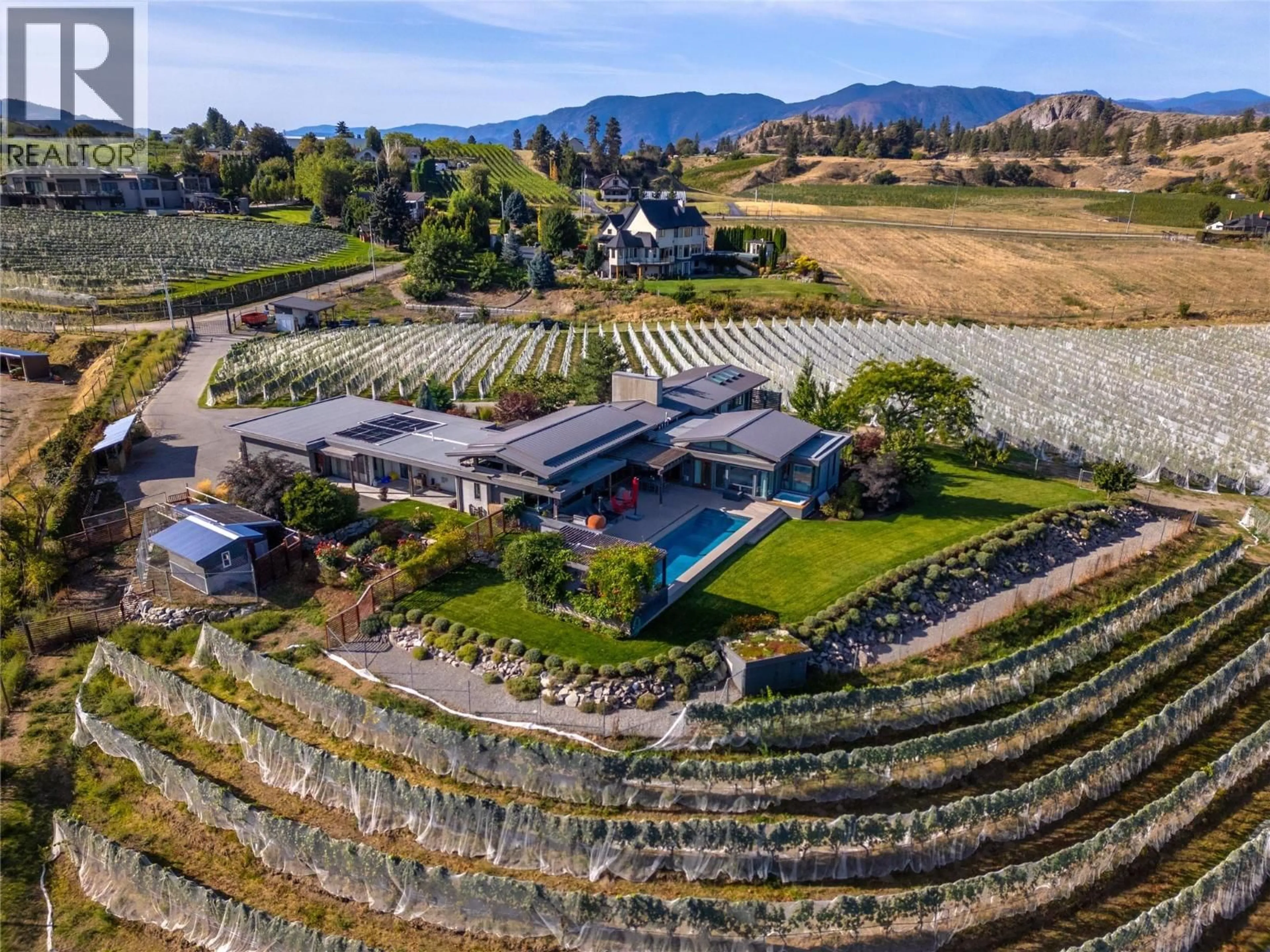 A pic from outside/outdoor area/front of a property/back of a property/a pic from drone, mountain view for 823 SWORDER ROAD, Penticton British Columbia V2A8V2