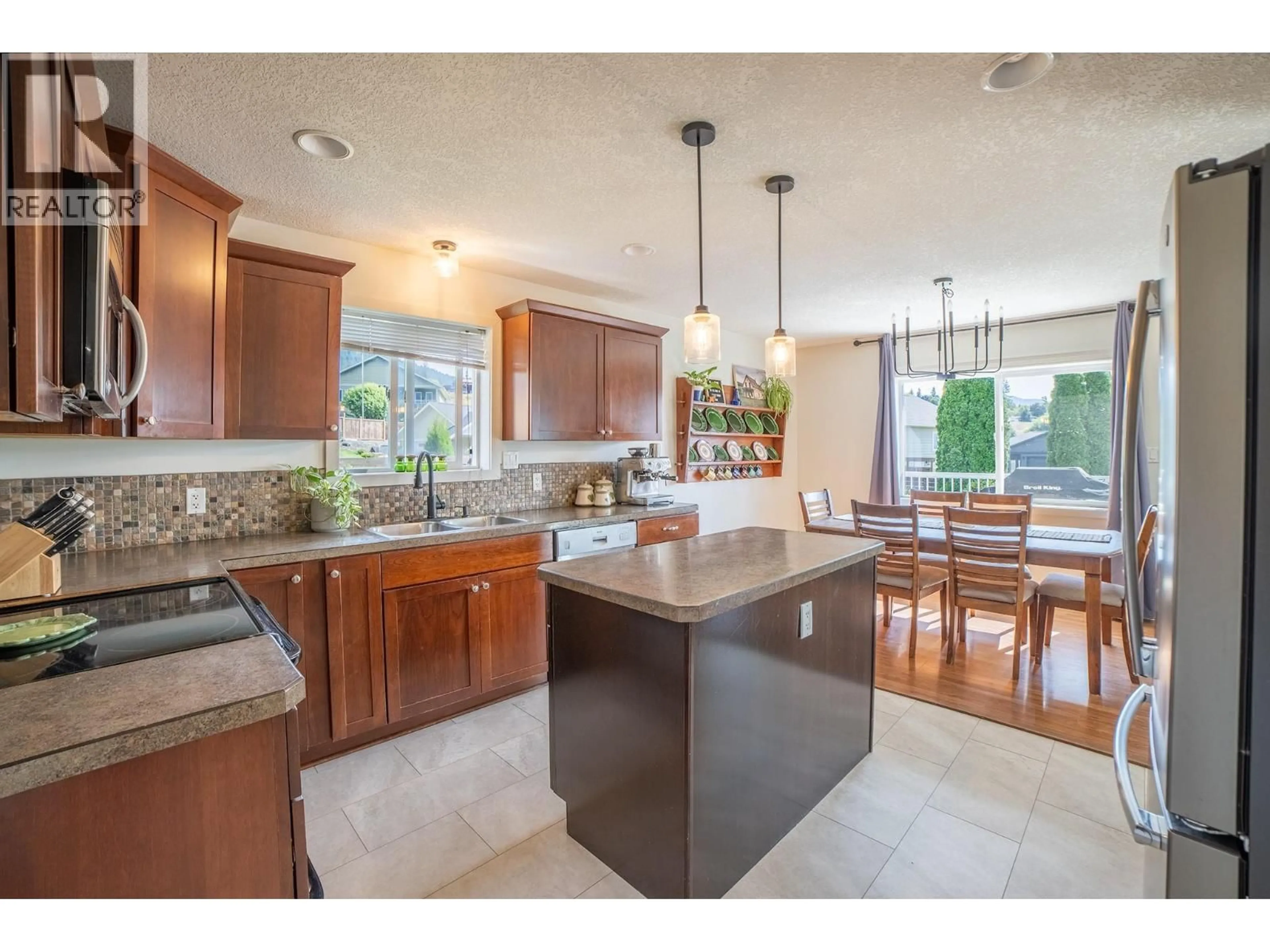 Open concept kitchen, ceramic/tile floor for 908 PURCELL CRESCENT, Creston British Columbia V0B1G3