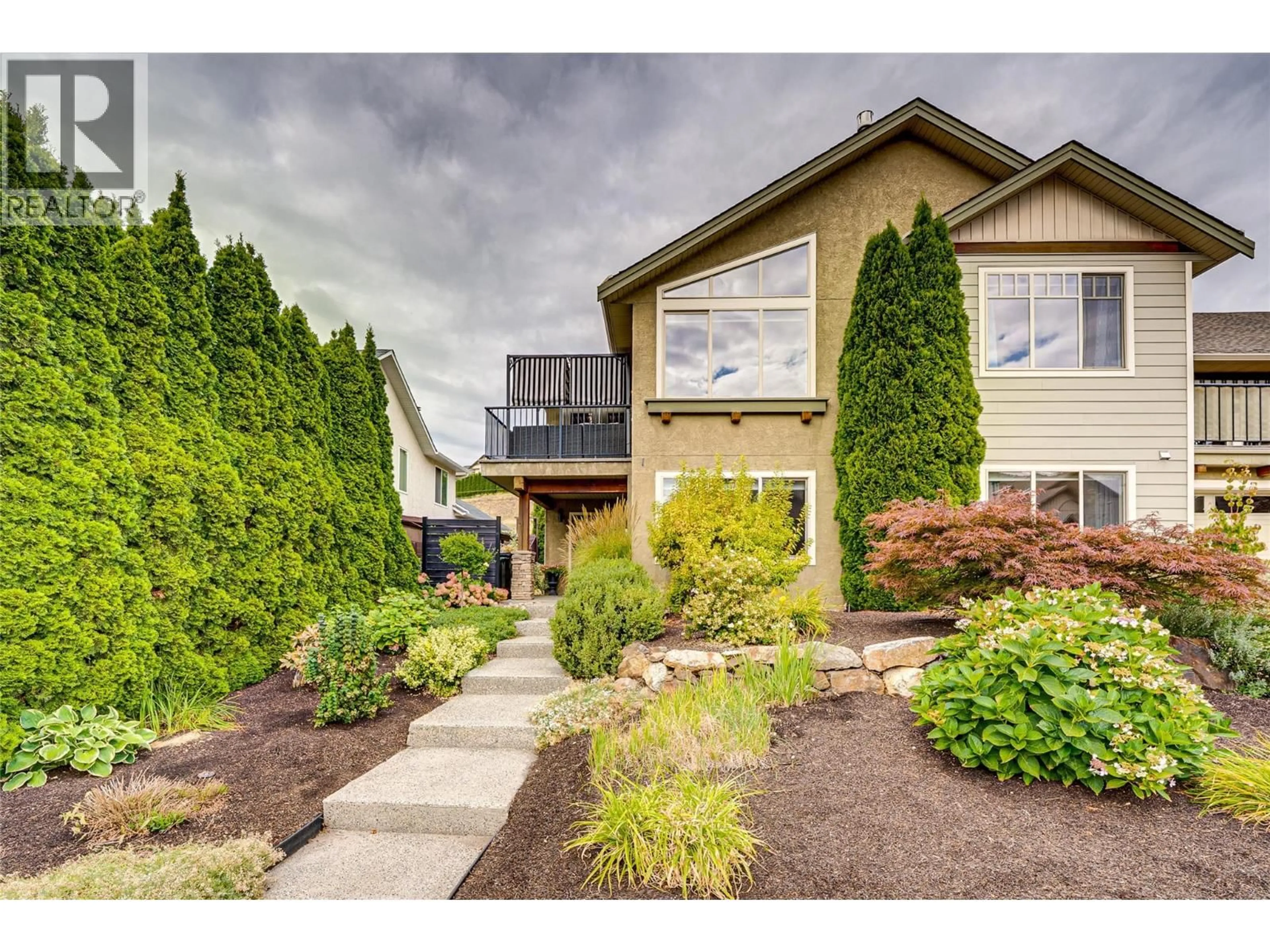 Home with vinyl exterior material, street for 1 - 6933 MANNING PLACE, Vernon British Columbia V1B2Y6