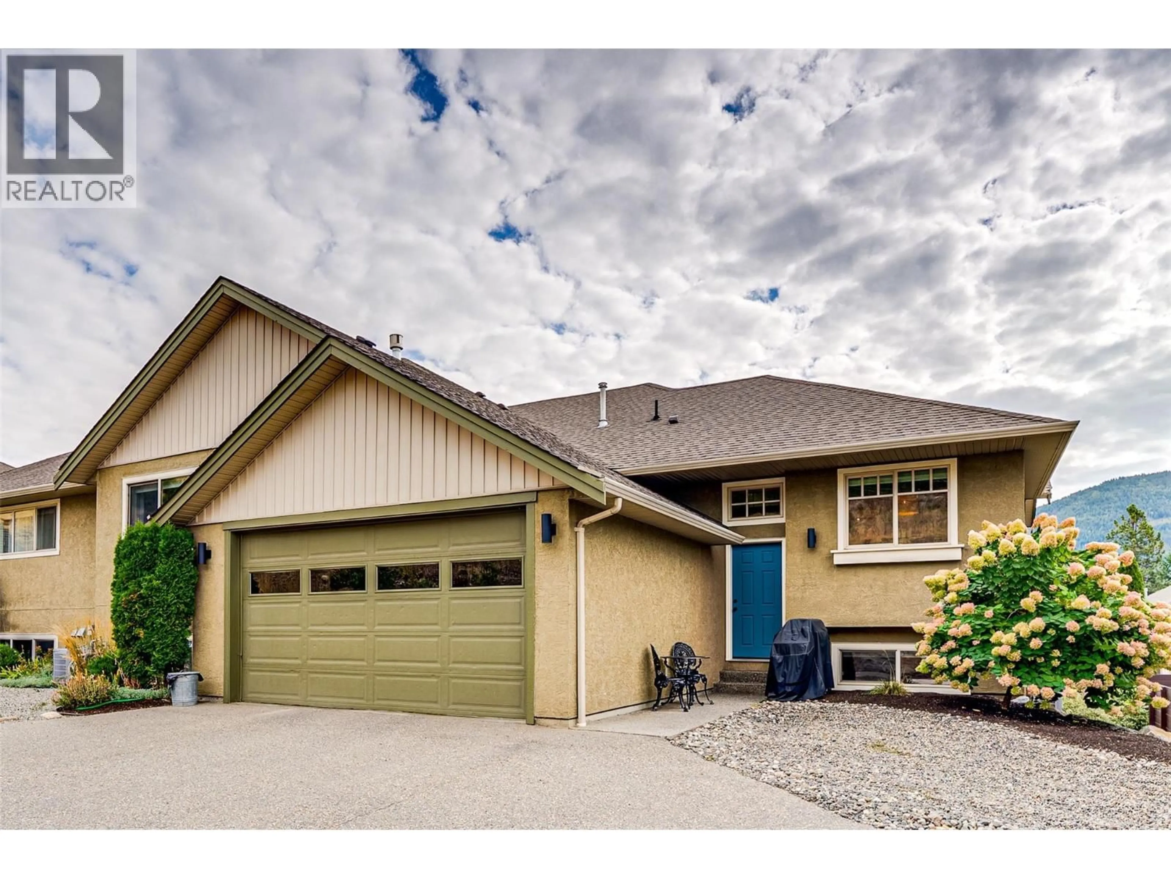 Home with vinyl exterior material, street for 1 - 6933 MANNING PLACE, Vernon British Columbia V1B2Y6