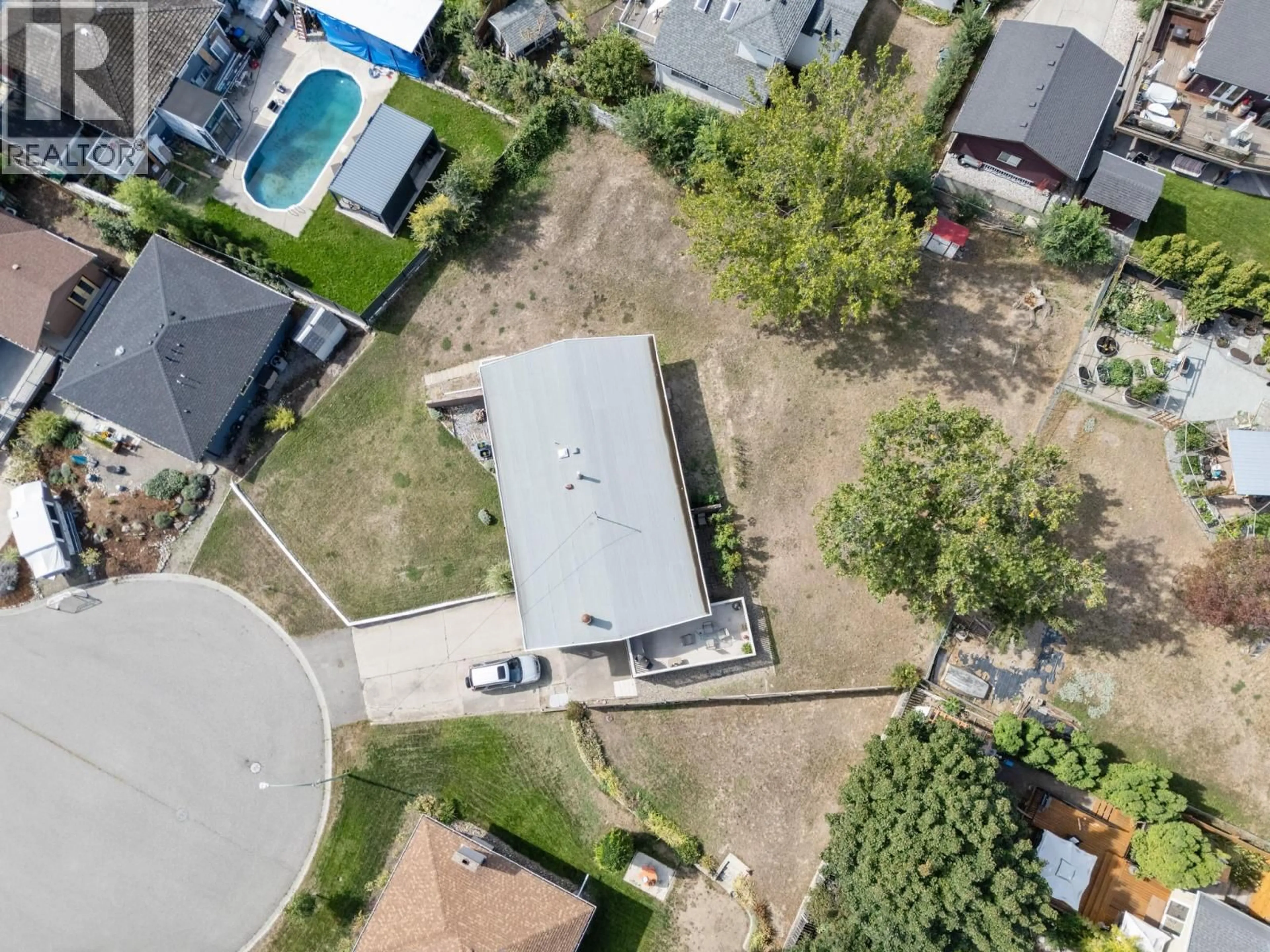 A pic from outside/outdoor area/front of a property/back of a property/a pic from drone, street for 1440 GLENAIRE CRESCENT, Kelowna British Columbia V1Y3N1