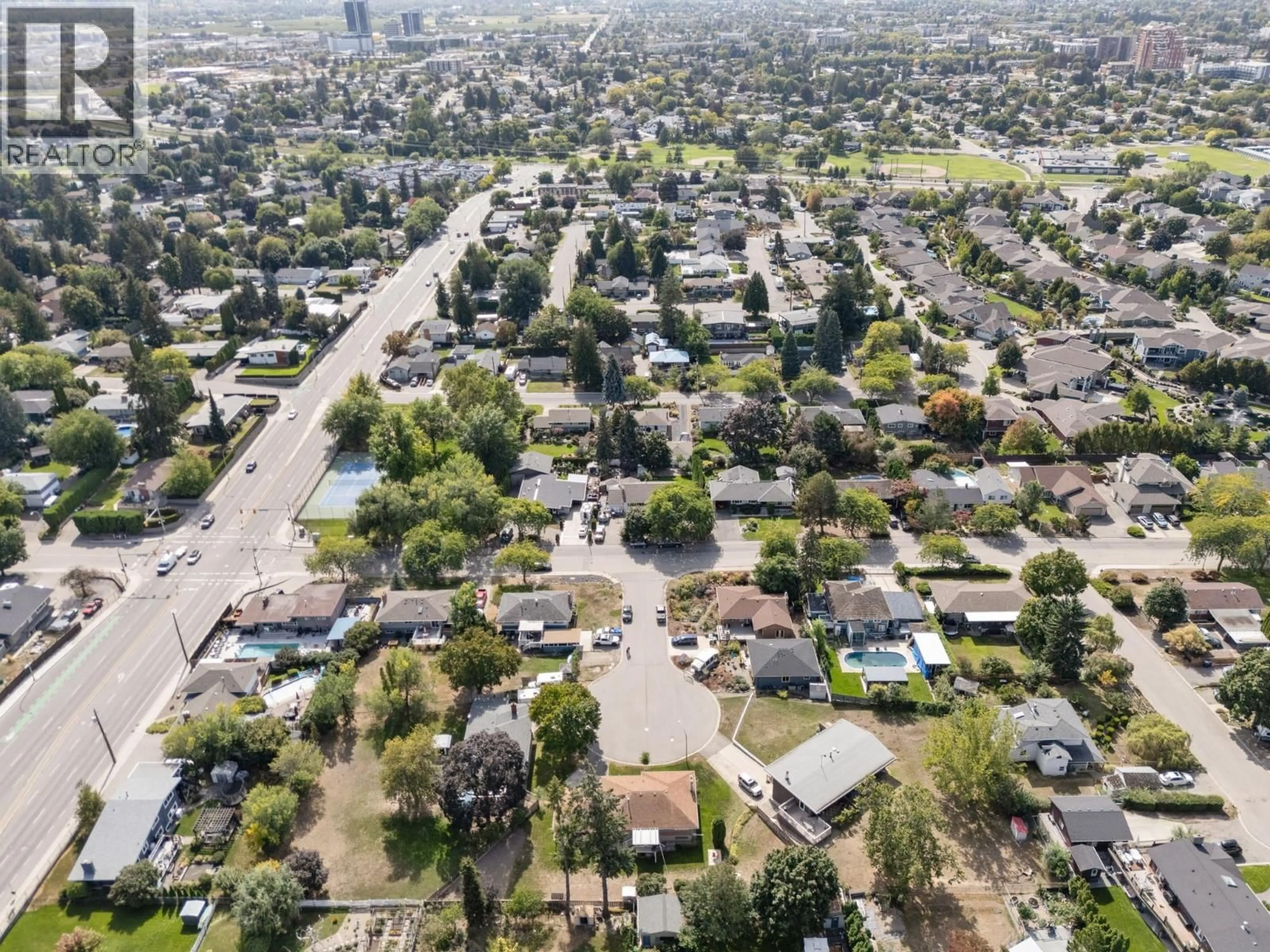 A pic from outside/outdoor area/front of a property/back of a property/a pic from drone, street for 1440 GLENAIRE CRESCENT, Kelowna British Columbia V1Y3N1