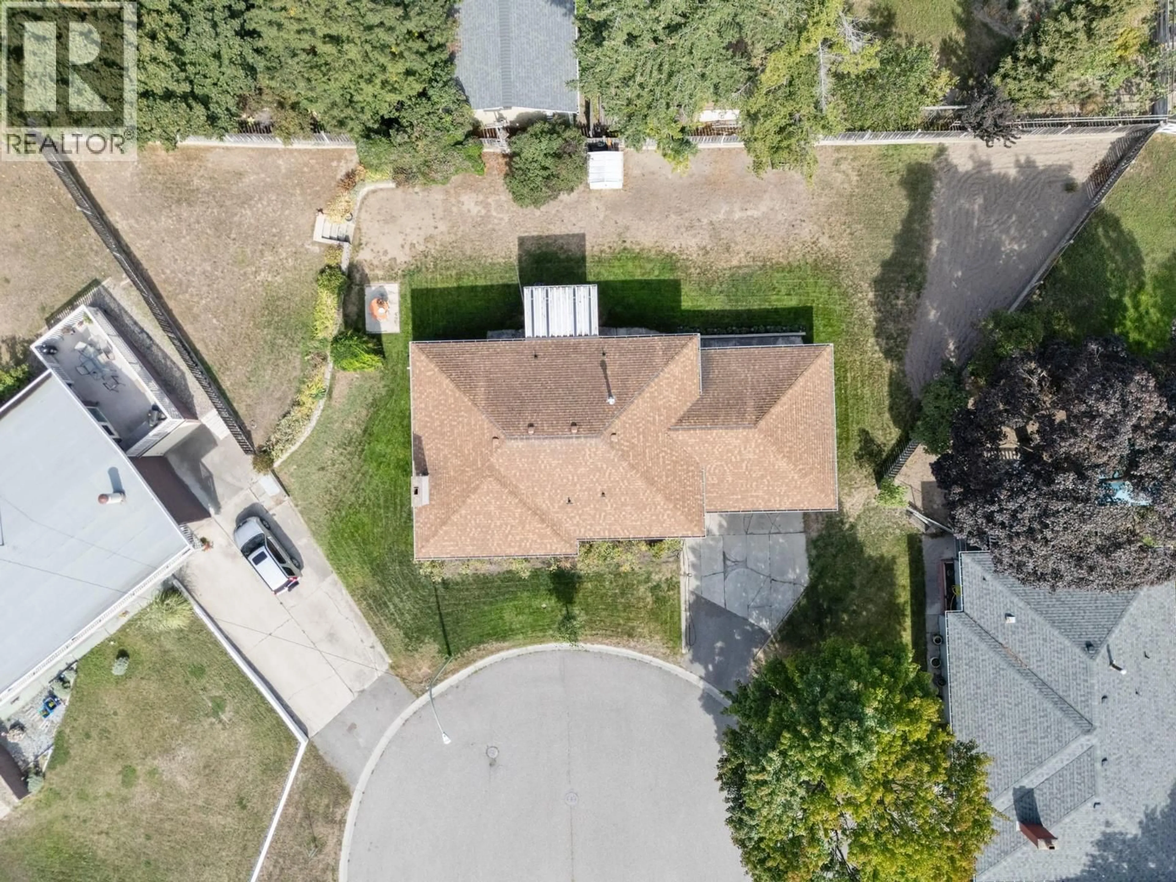 A pic from outside/outdoor area/front of a property/back of a property/a pic from drone, street for 1442 GLENAIRE CRESCENT, Kelowna British Columbia V1Y3N1