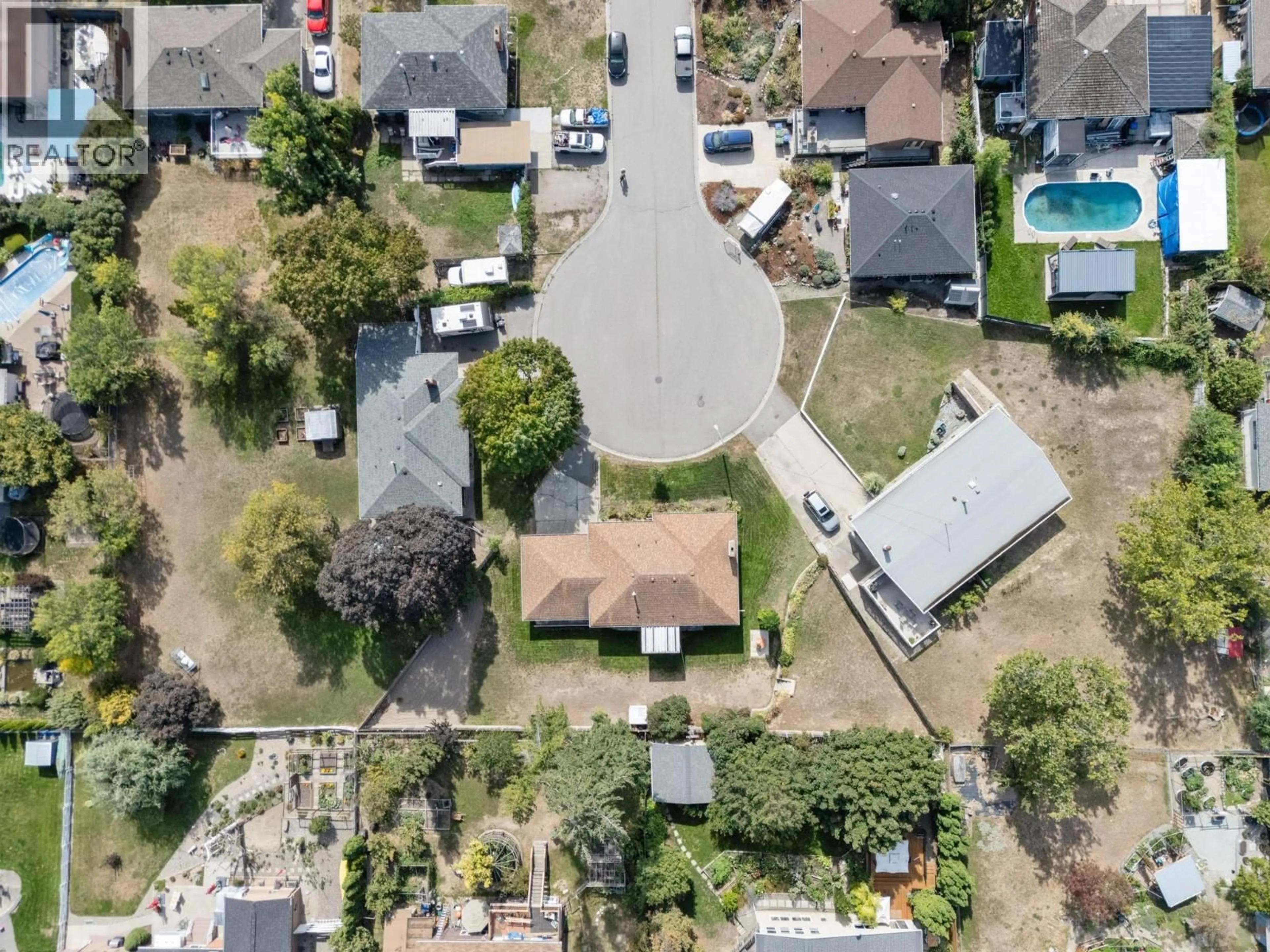 A pic from outside/outdoor area/front of a property/back of a property/a pic from drone, street for 1442 GLENAIRE CRESCENT, Kelowna British Columbia V1Y3N1