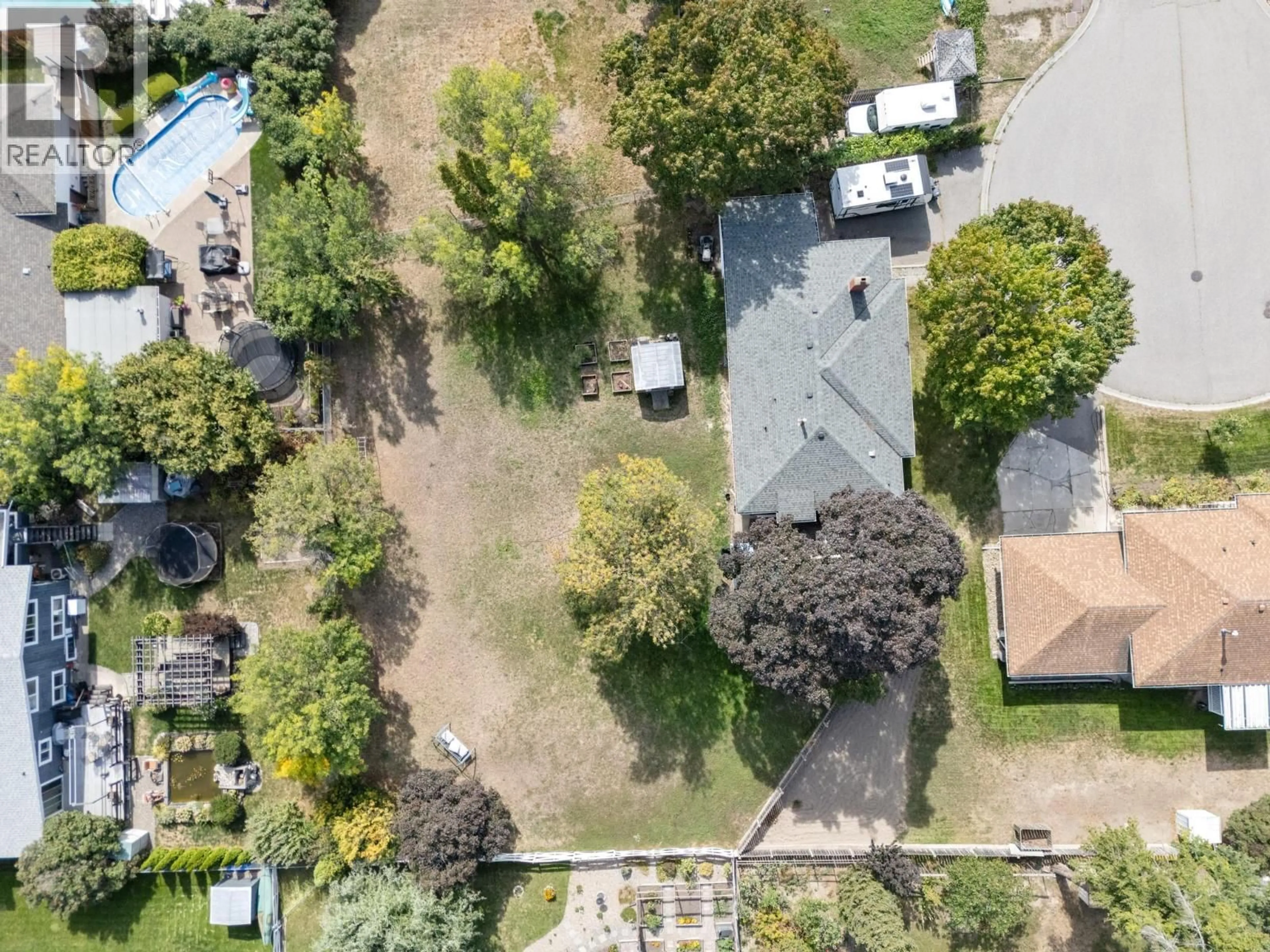A pic from outside/outdoor area/front of a property/back of a property/a pic from drone, street for 1446 GLENAIRE CRESCENT, Kelowna British Columbia V1Y3N1