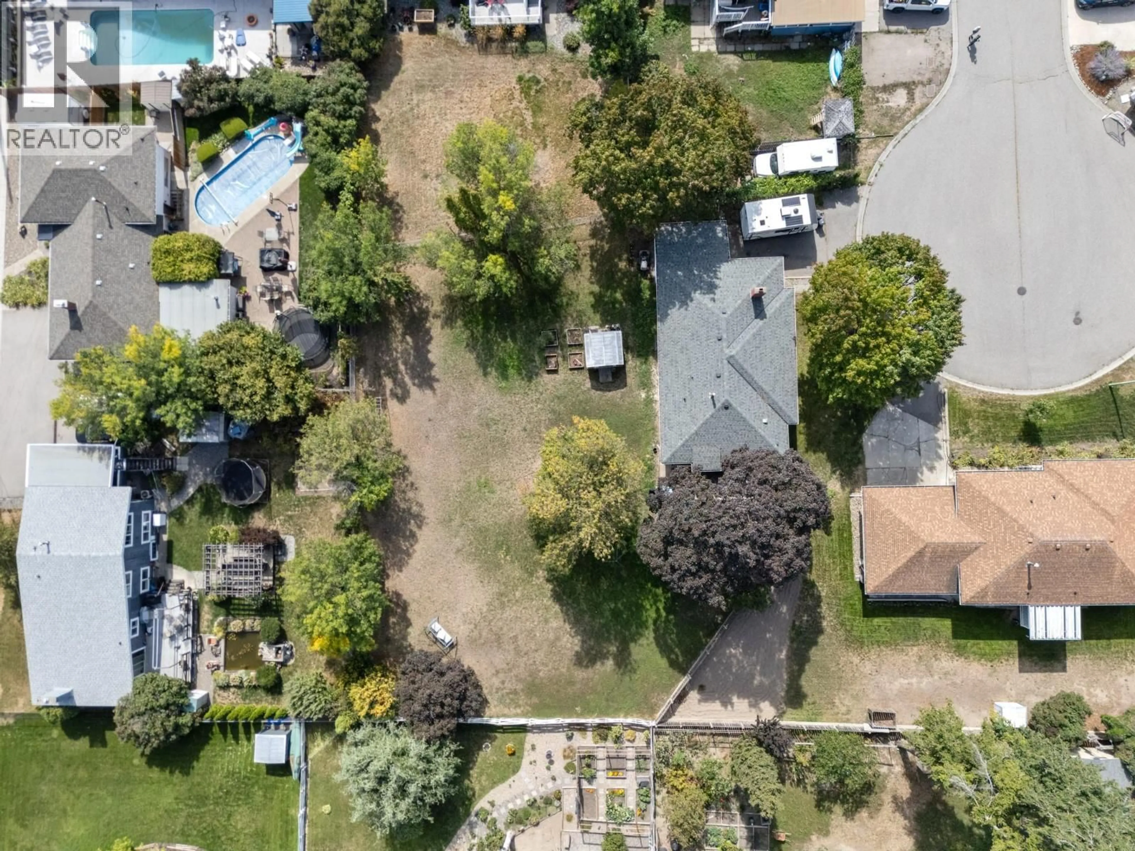 A pic from outside/outdoor area/front of a property/back of a property/a pic from drone, street for 1446 GLENAIRE CRESCENT, Kelowna British Columbia V1Y3N1