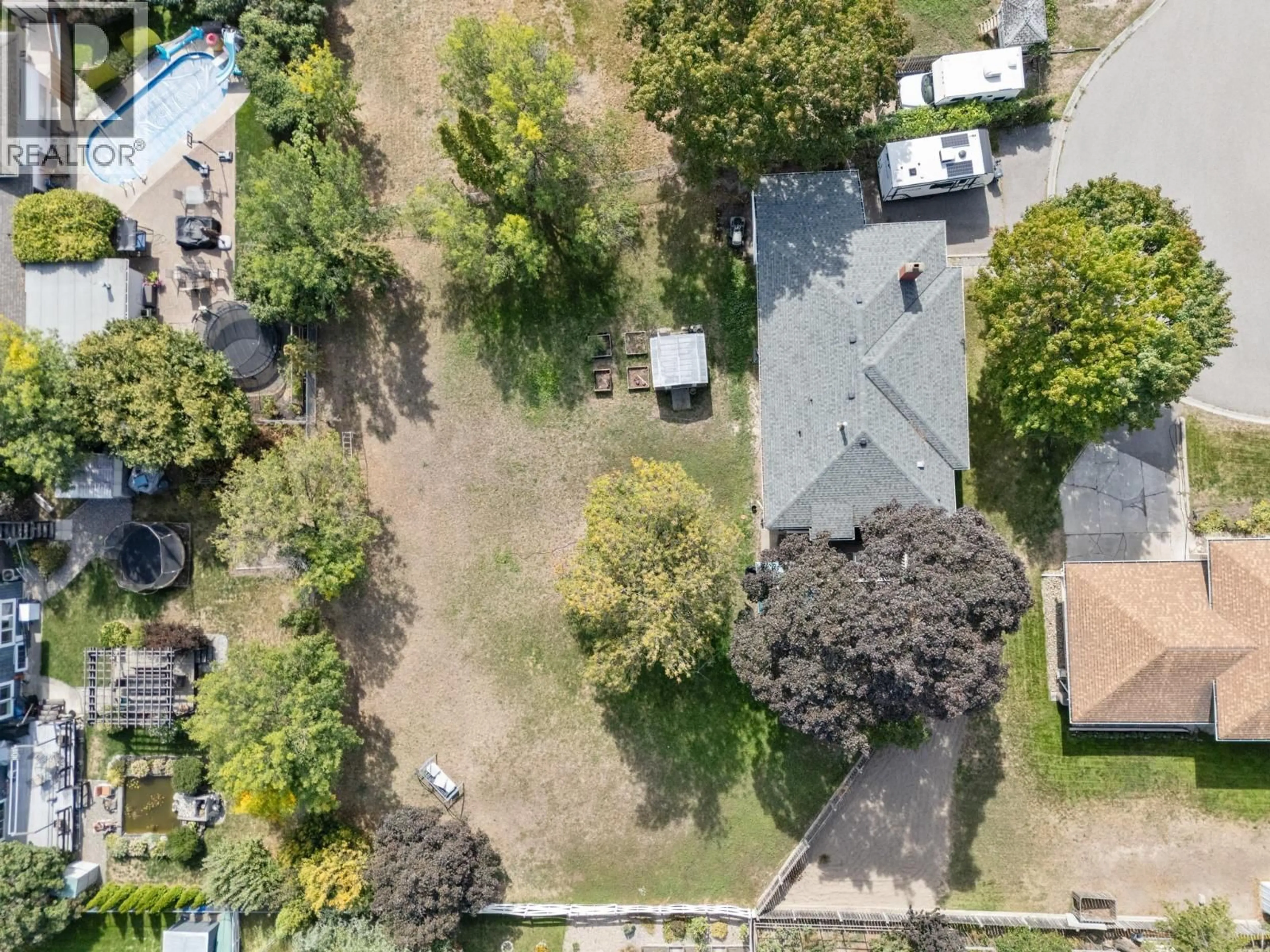 A pic from outside/outdoor area/front of a property/back of a property/a pic from drone, street for 1446 GLENAIRE CRESCENT, Kelowna British Columbia V1Y3N1