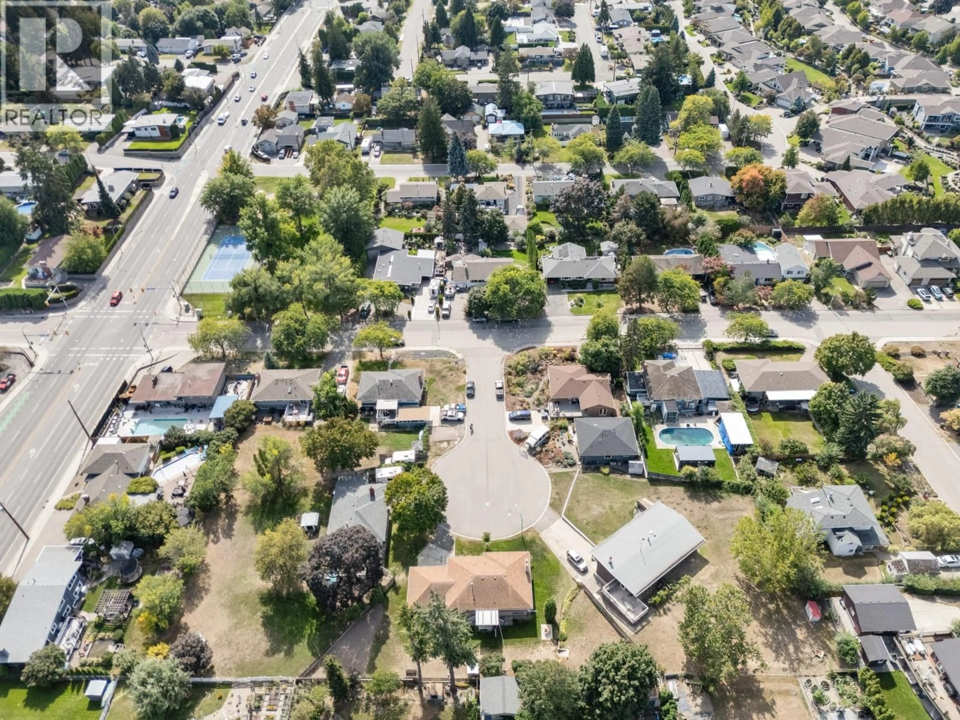 A pic from outside/outdoor area/front of a property/back of a property/a pic from drone, street for 1446 GLENAIRE CRESCENT, Kelowna British Columbia V1Y3N1