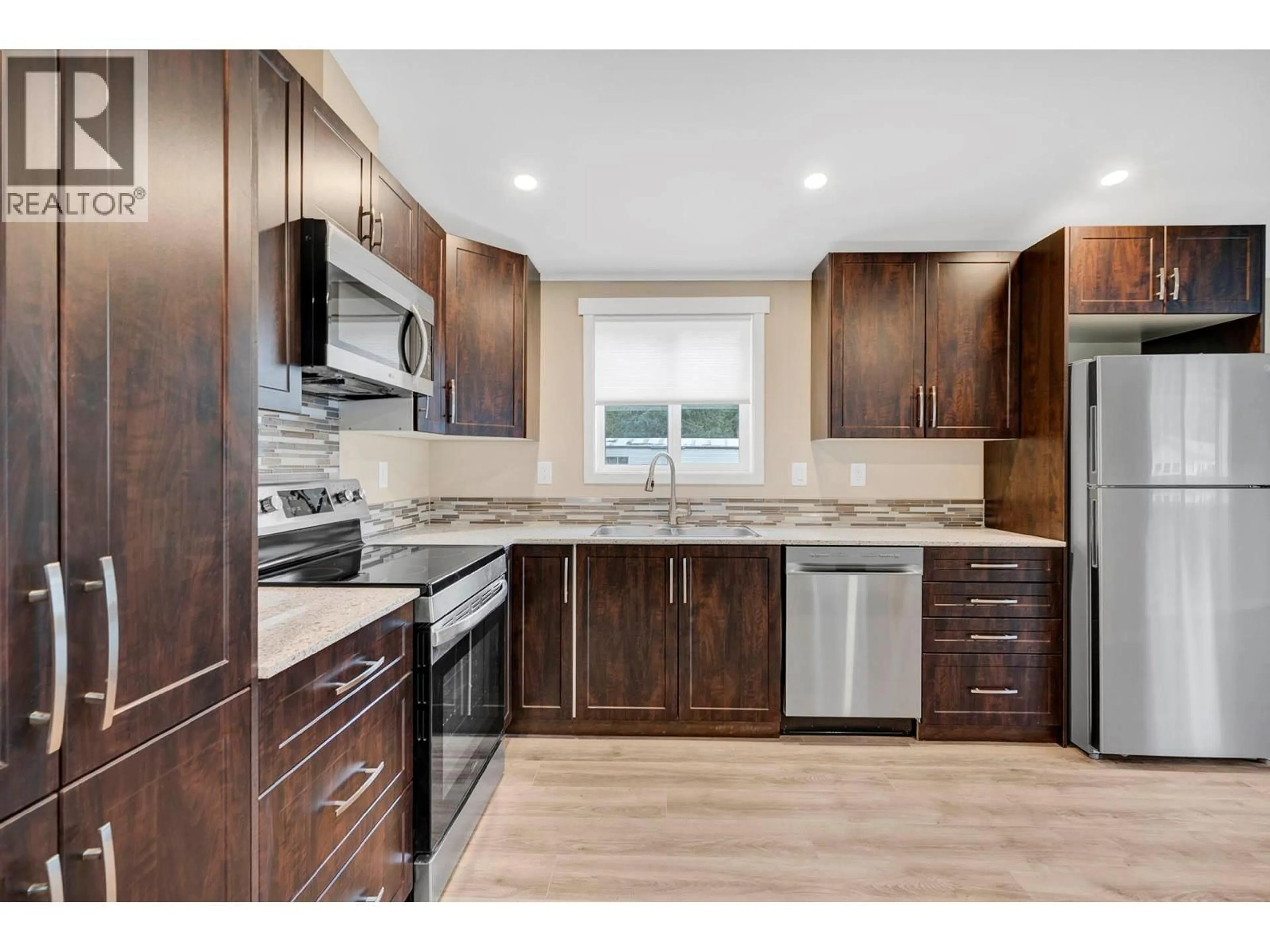 Standard kitchen, wood/laminate floor for 34 - 121 FERRY ROAD, Clearwater British Columbia V0E1N2