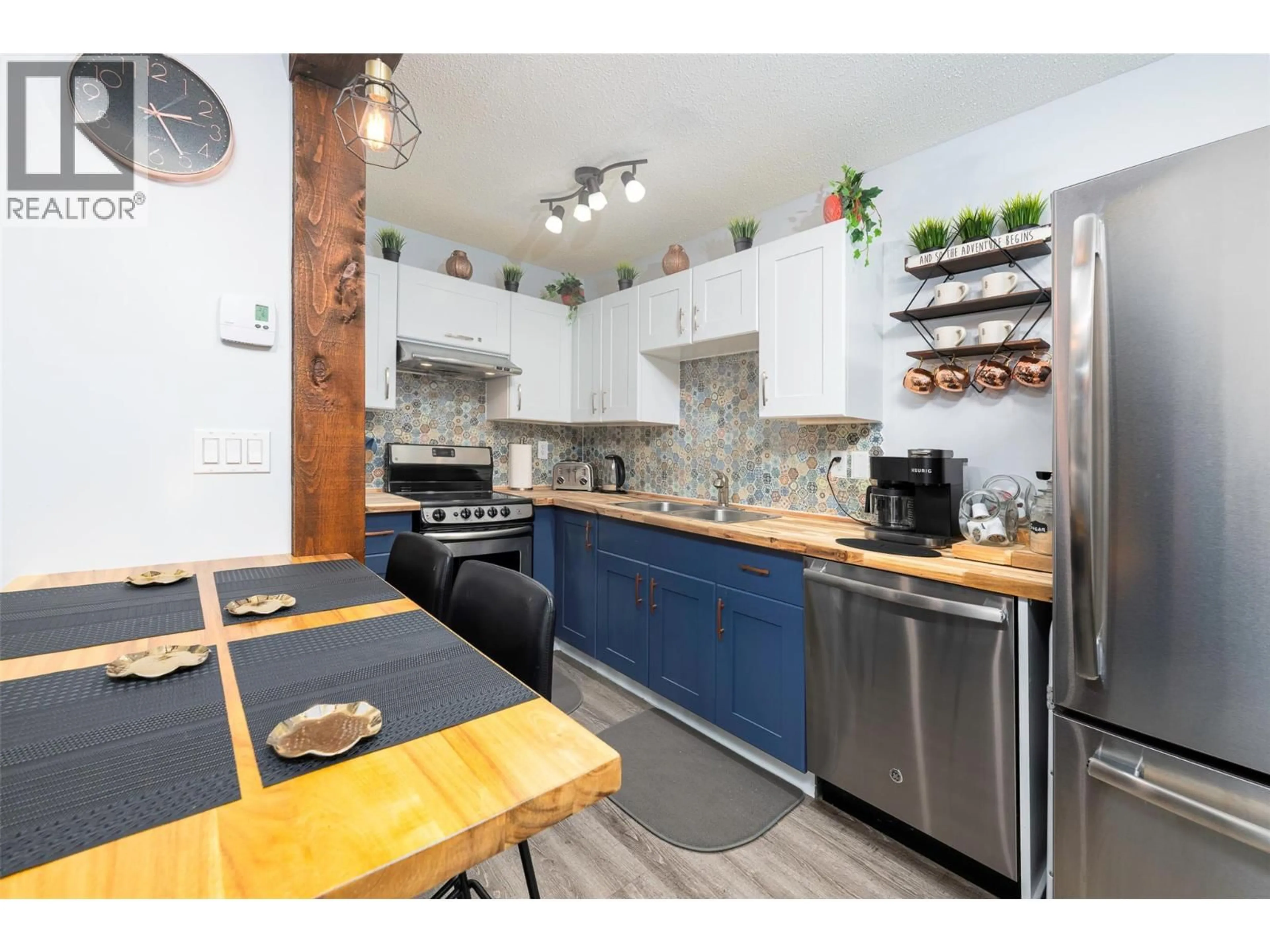 Open concept kitchen, wood/laminate floor for 309 - 6375 WHISKEY JACK DRIVE, Big White British Columbia V1P1P3