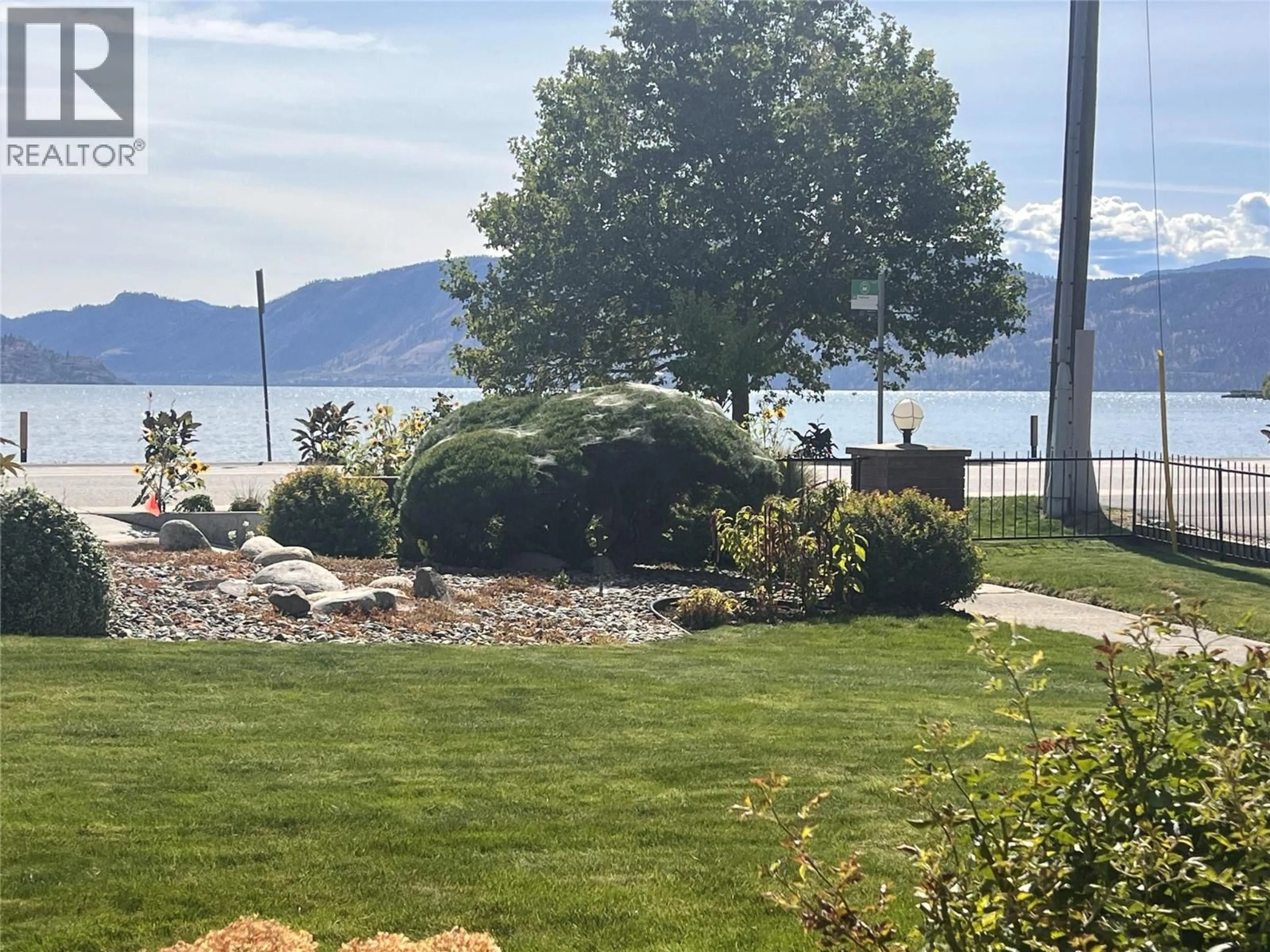 A pic from outside/outdoor area/front of a property/back of a property/a pic from drone, water/lake/river/ocean view for 106 - 4340 BEACH AVENUE, Peachland British Columbia V0H1X6