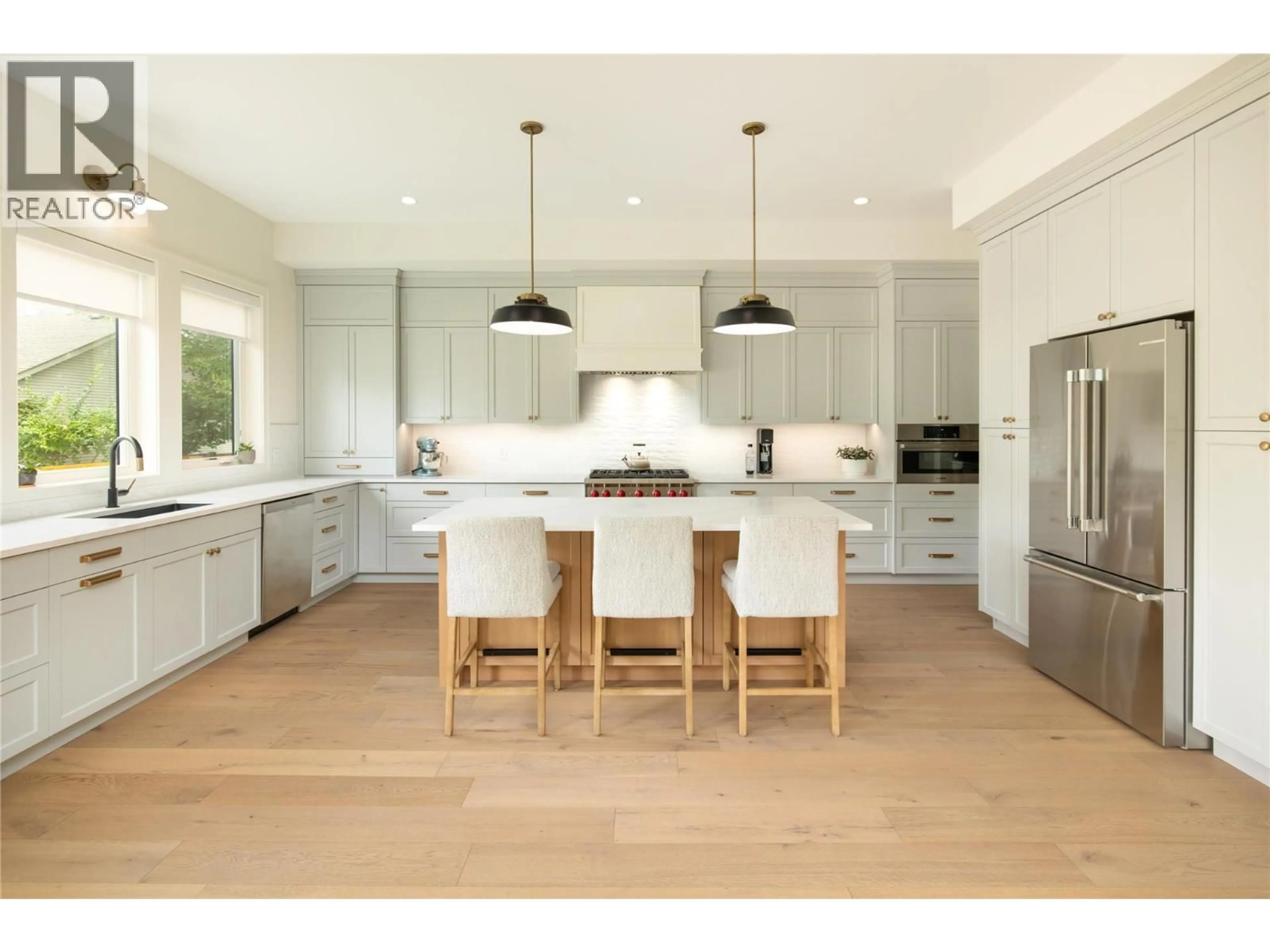 Open concept kitchen, wood/laminate floor for 712 HAZELL ROAD, Kelowna British Columbia V1W1R3