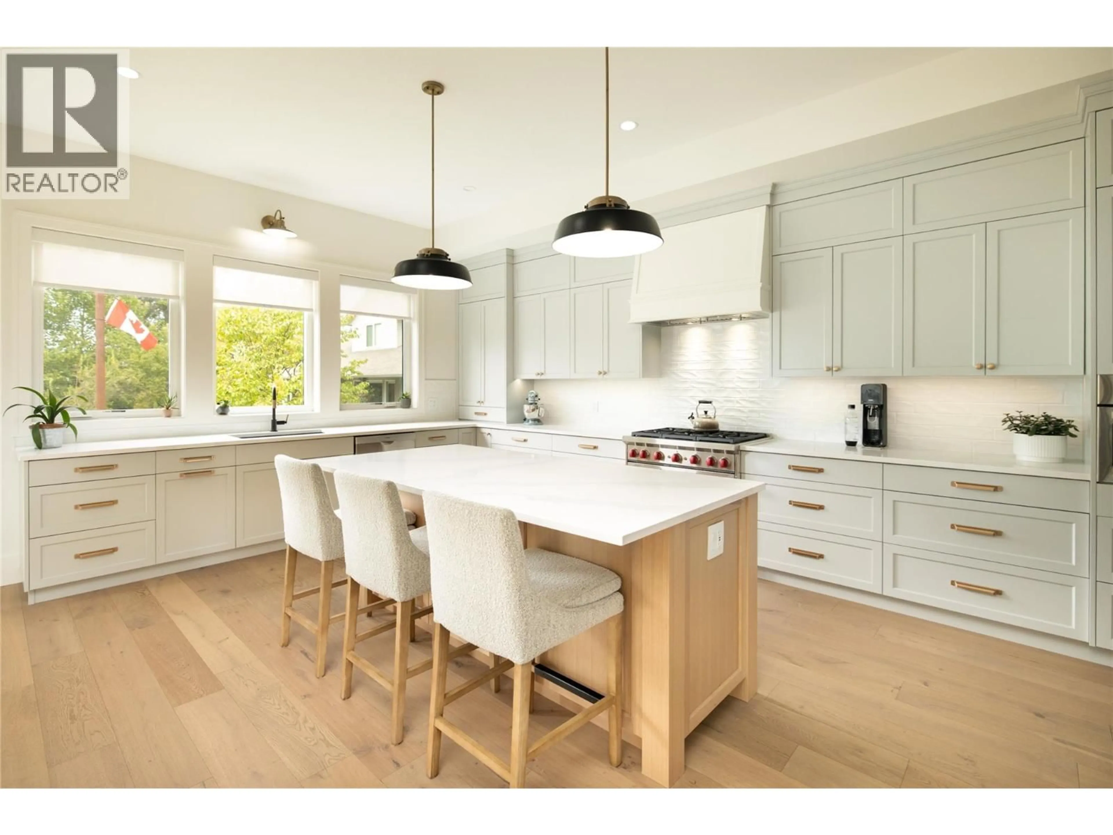Open concept kitchen, wood/laminate floor for 712 HAZELL ROAD, Kelowna British Columbia V1W1R3
