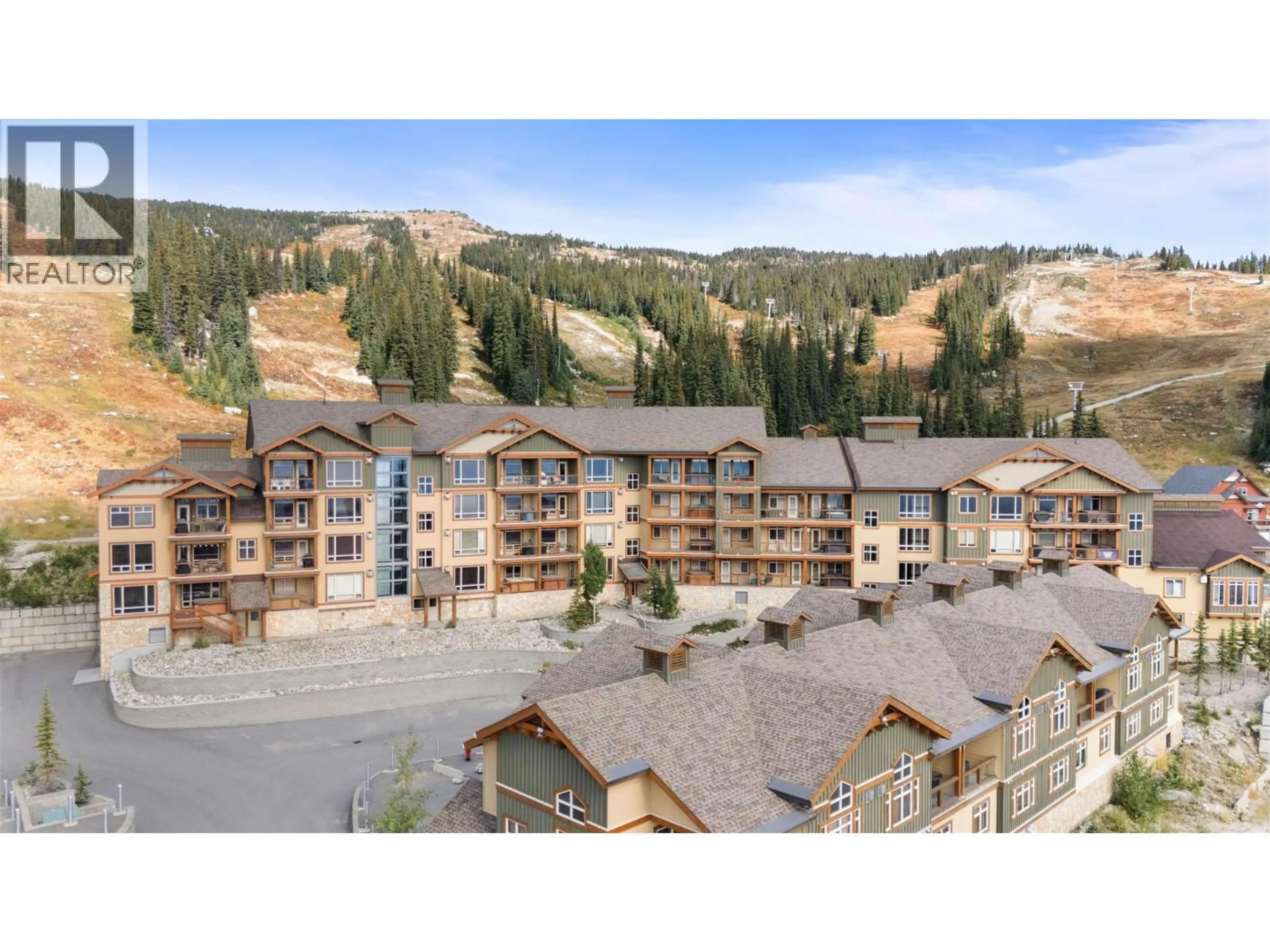 A pic from outside/outdoor area/front of a property/back of a property/a pic from drone, mountain view for 3-404 - 7700 PORCUPINE ROAD, Big White British Columbia V1P1P3