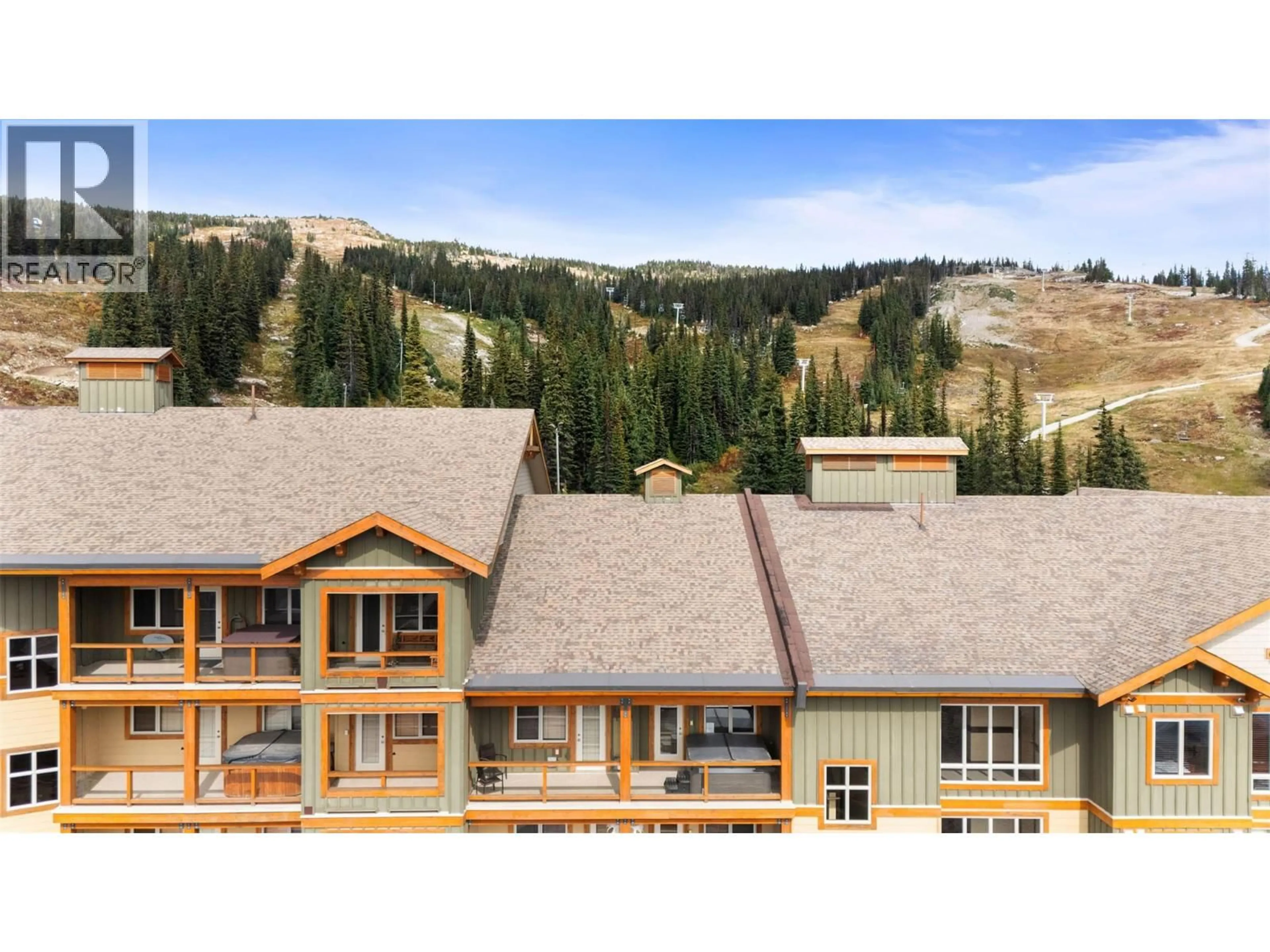 A pic from outside/outdoor area/front of a property/back of a property/a pic from drone, mountain view for 3-404 - 7700 PORCUPINE ROAD, Big White British Columbia V1P1P3