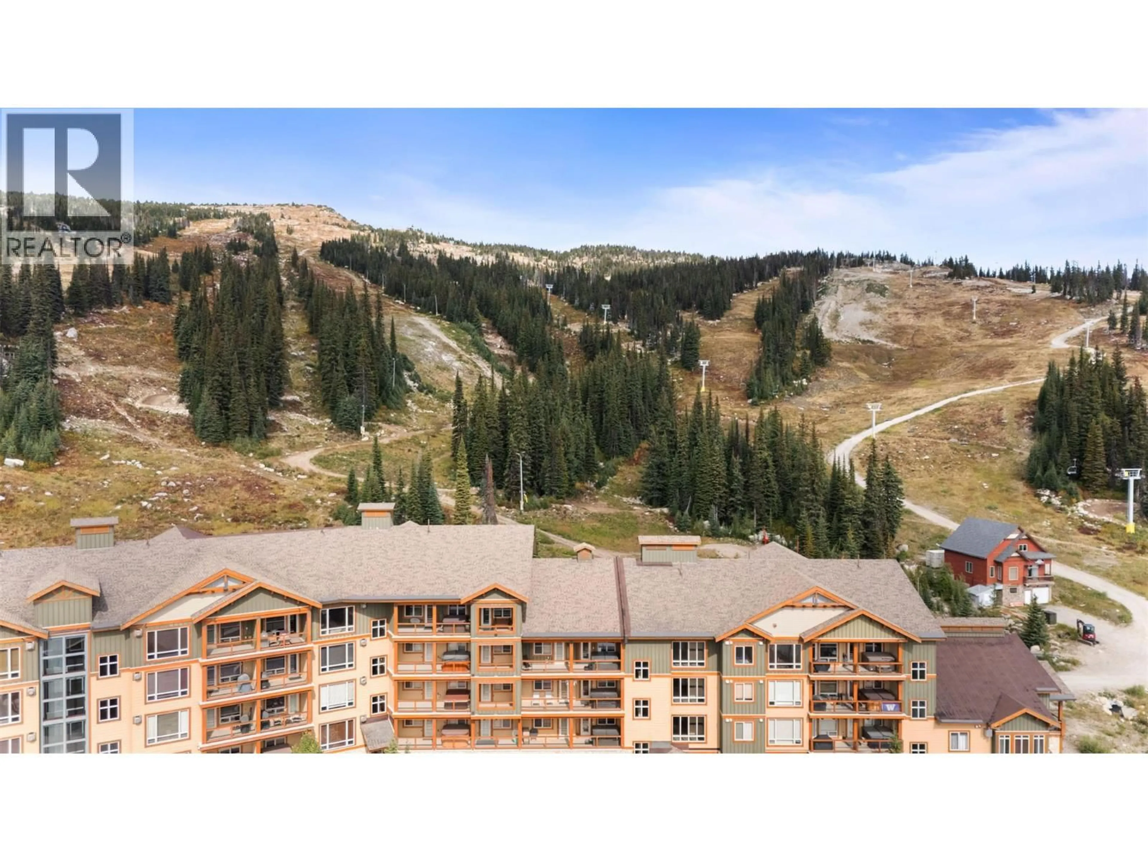 A pic from outside/outdoor area/front of a property/back of a property/a pic from drone, mountain view for 3-404 - 7700 PORCUPINE ROAD, Big White British Columbia V1P1P3