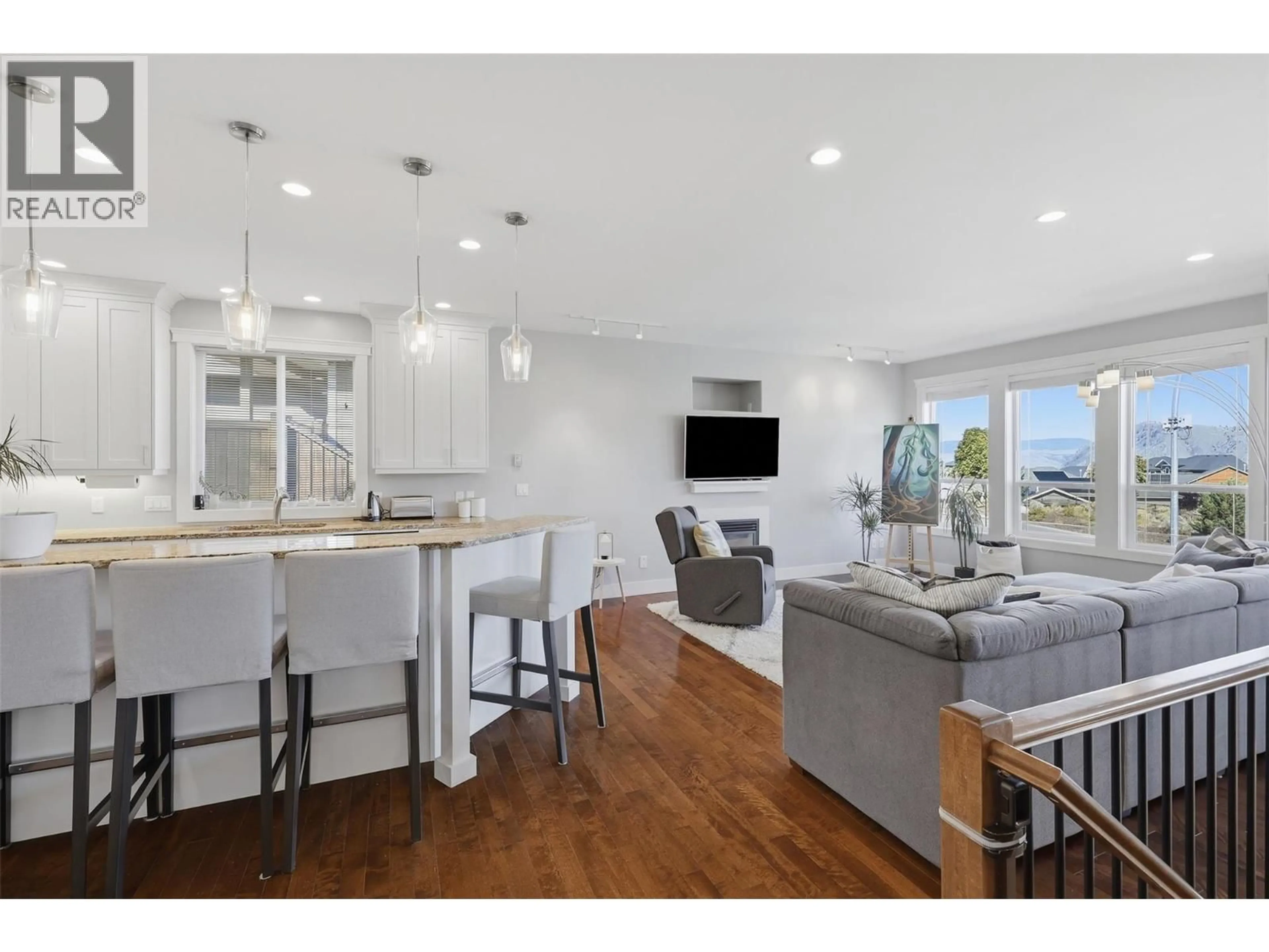 Open concept kitchen, wood/laminate floor for 1933 GALORE CRESCENT, Kamloops British Columbia V2E0E7
