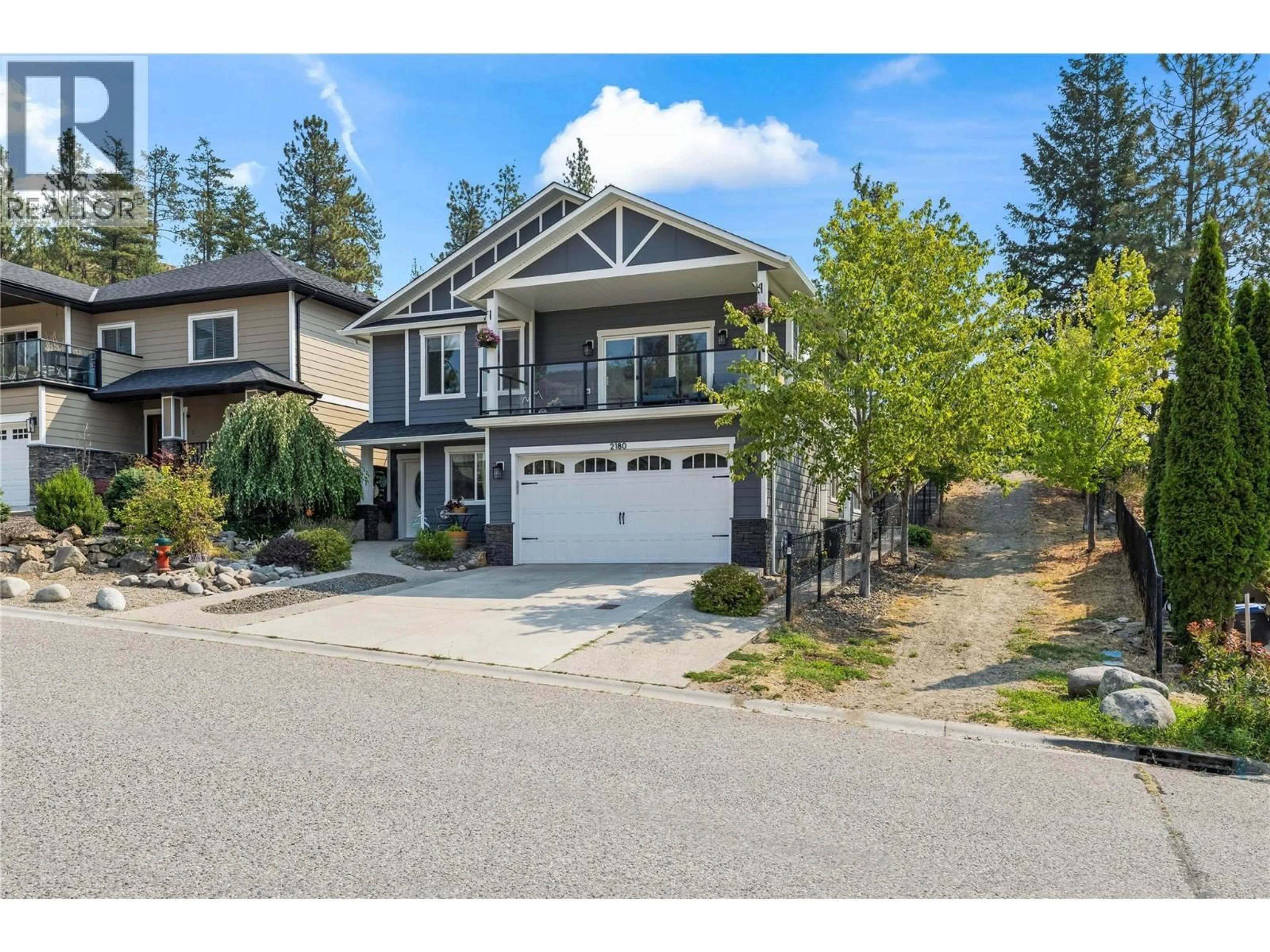 Home with vinyl exterior material, street for 2180 SUNVIEW DRIVE, West Kelowna British Columbia V1Z3X9