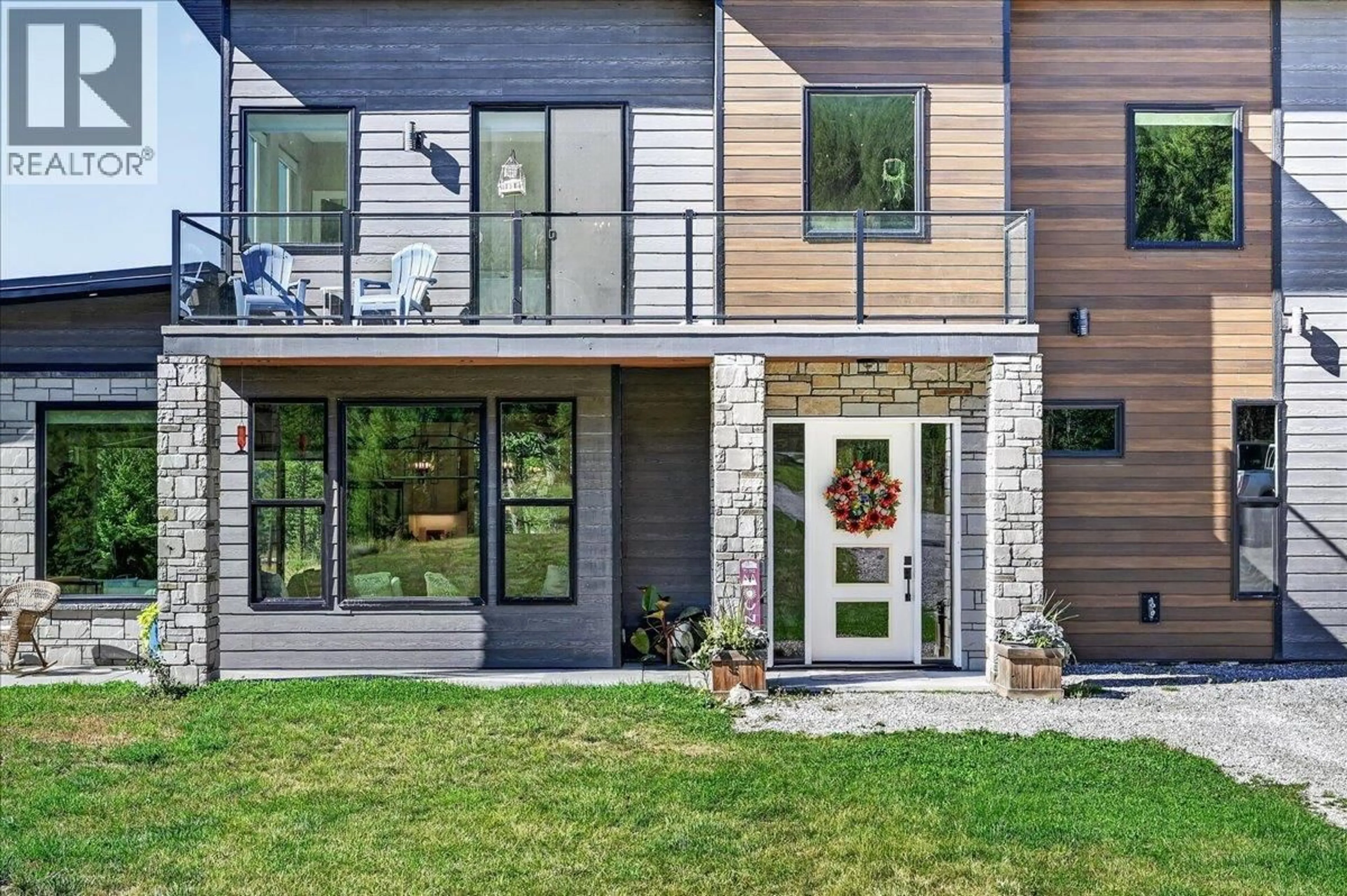 Home with brick exterior material, street for 4909 93/95 HIGHWAY, Fairmont Hot Springs British Columbia V0B1L1