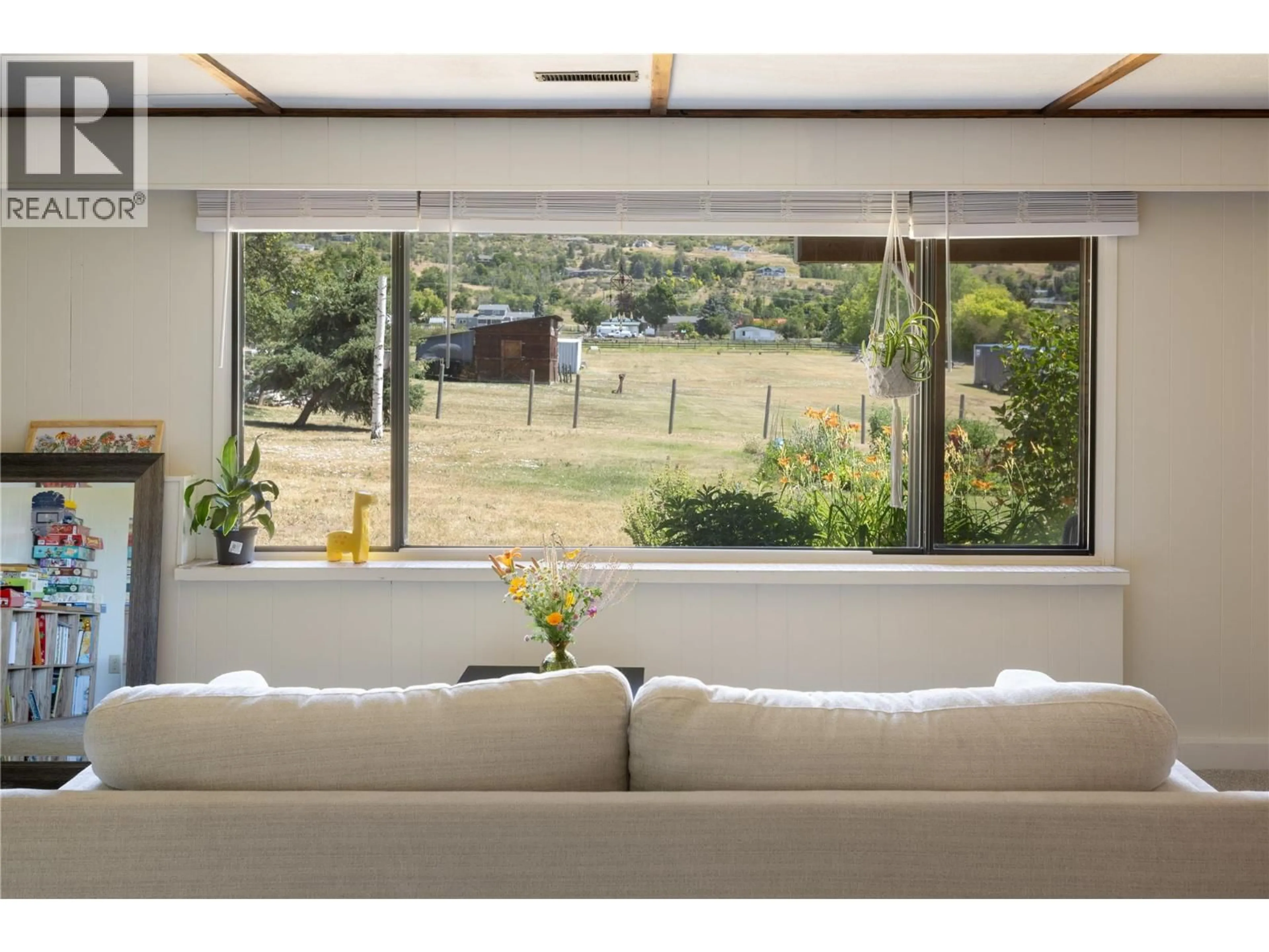 Living room with furniture, wood/laminate floor for 2271 FRANCIS STREET, Vernon British Columbia V1B3B4