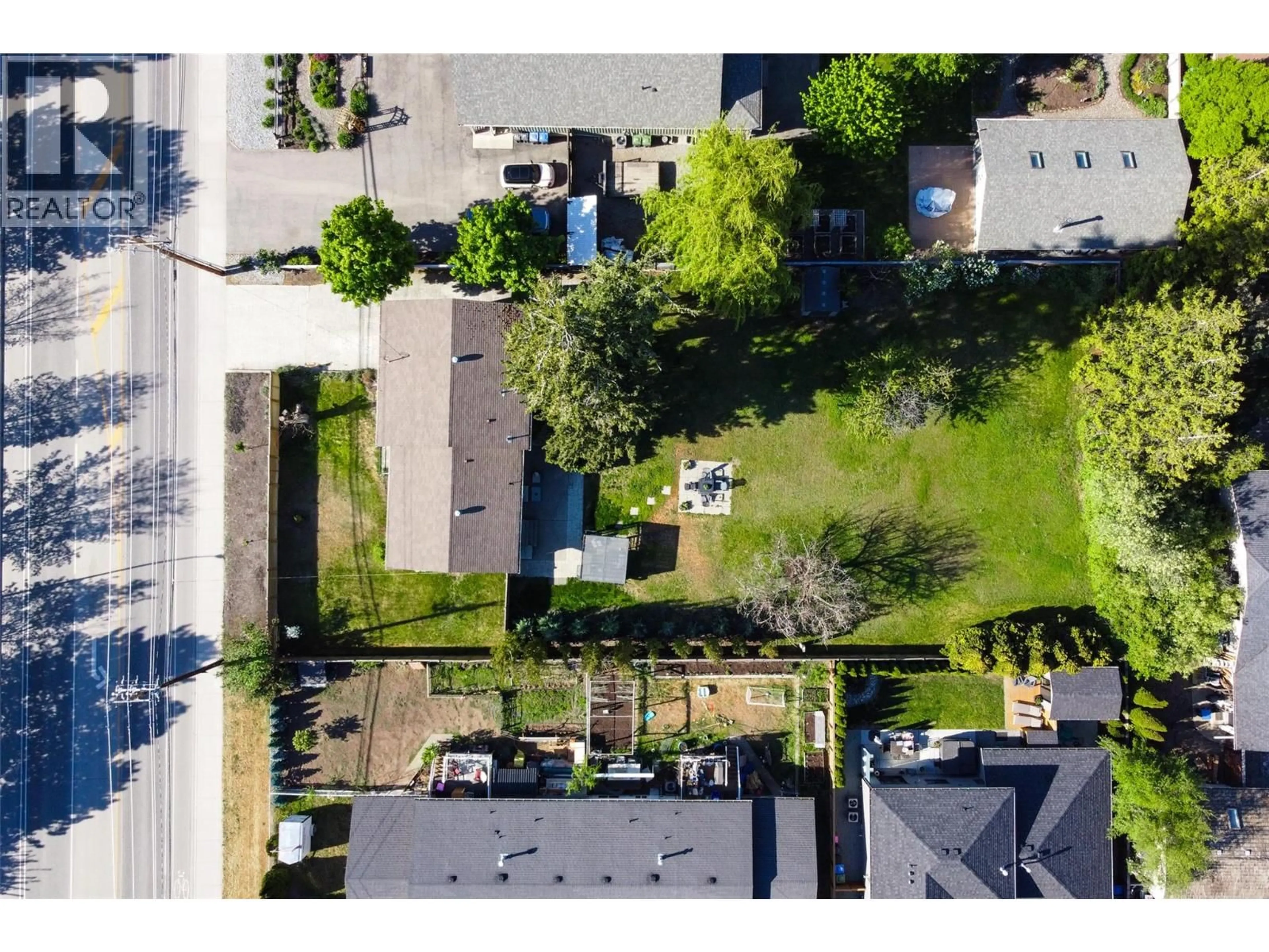 A pic from outside/outdoor area/front of a property/back of a property/a pic from drone, street for 4445 GORDON DRIVE, Kelowna British Columbia V1W1S9