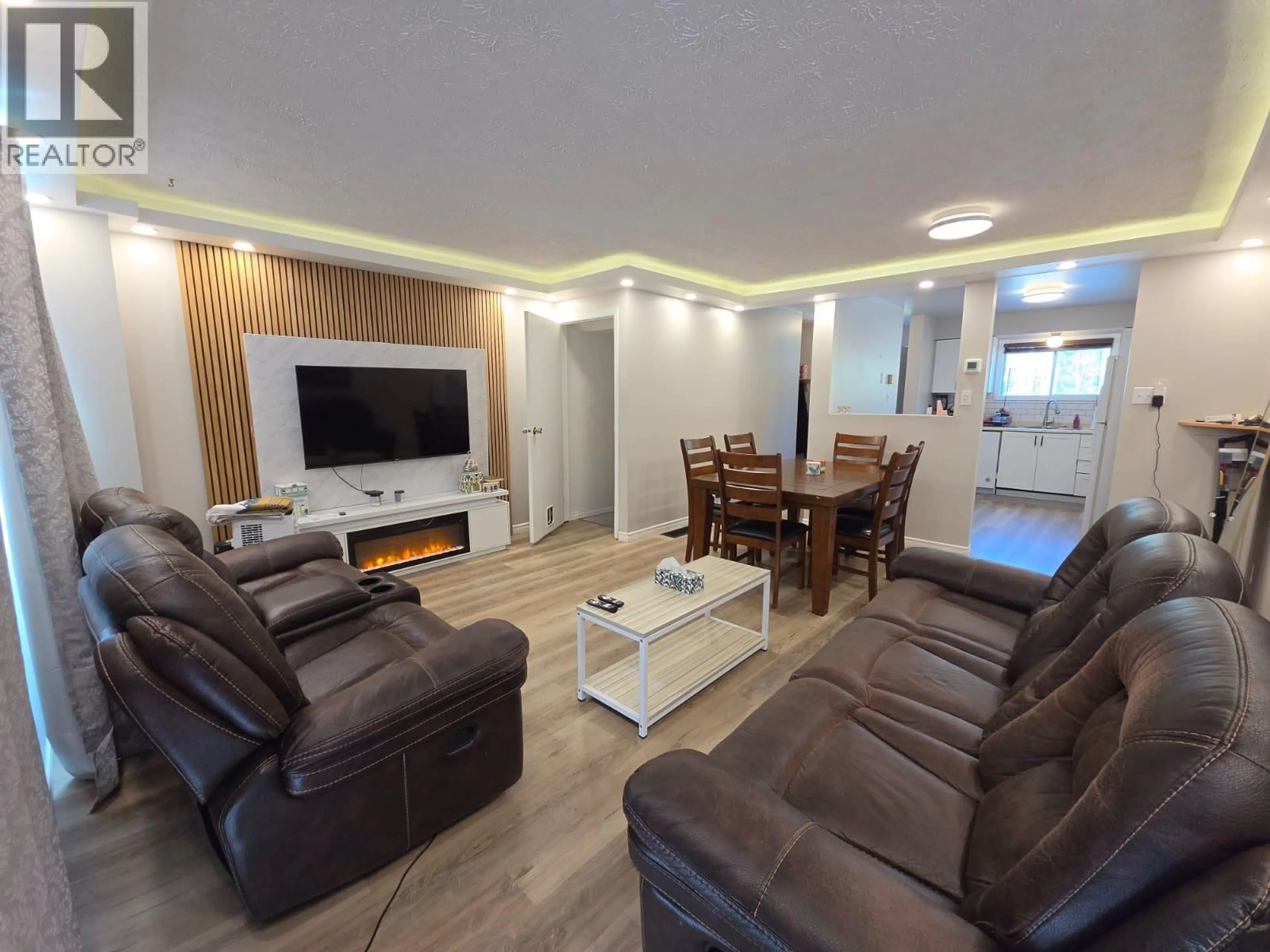 Living room with furniture, wood/laminate floor for 240 SPIEKER AVENUE, Tumbler Ridge British Columbia V0C2W0