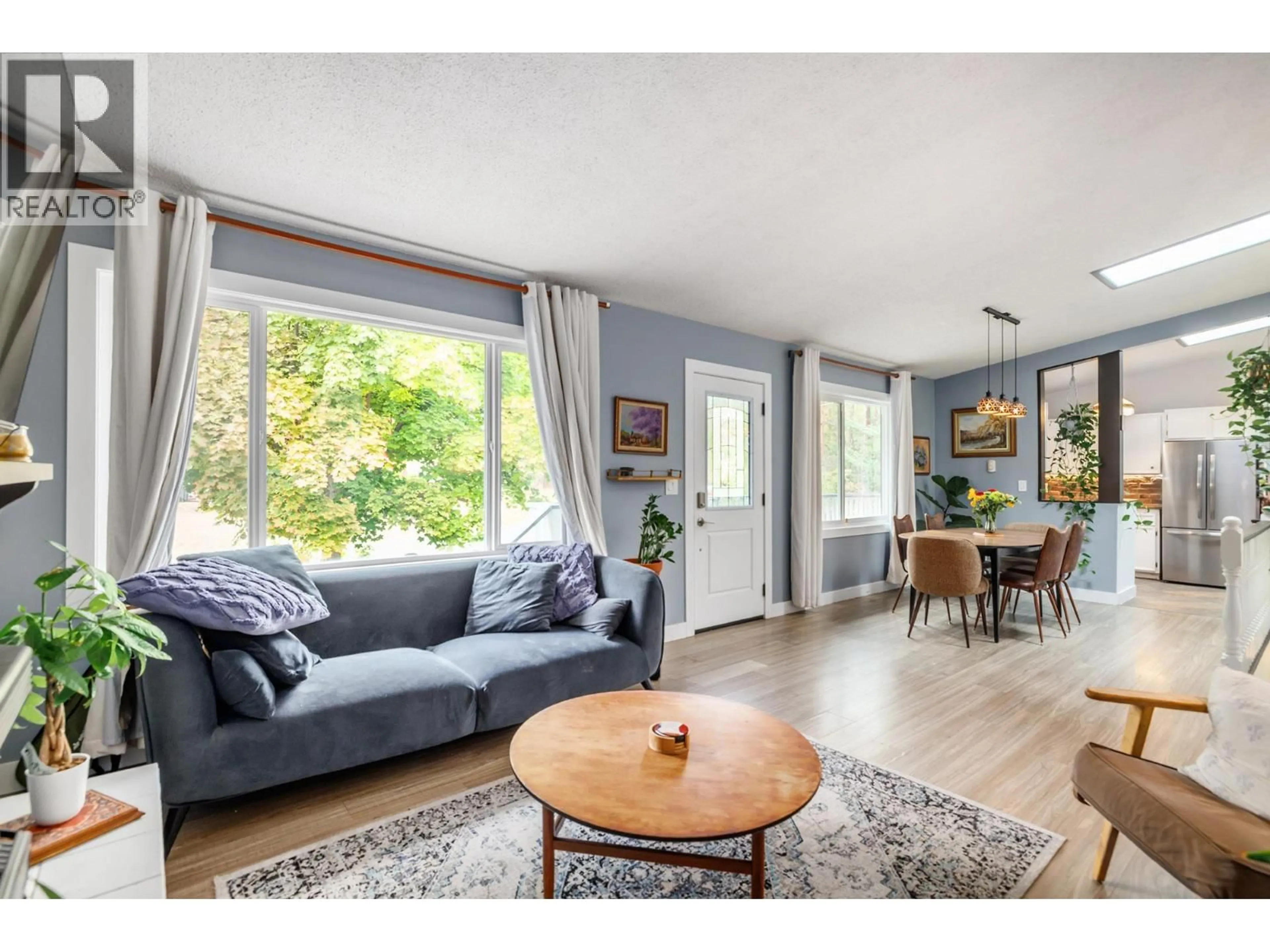 Living room with furniture, wood/laminate floor for 5215 PINERIDGE ROAD, Peachland British Columbia V0H1X8