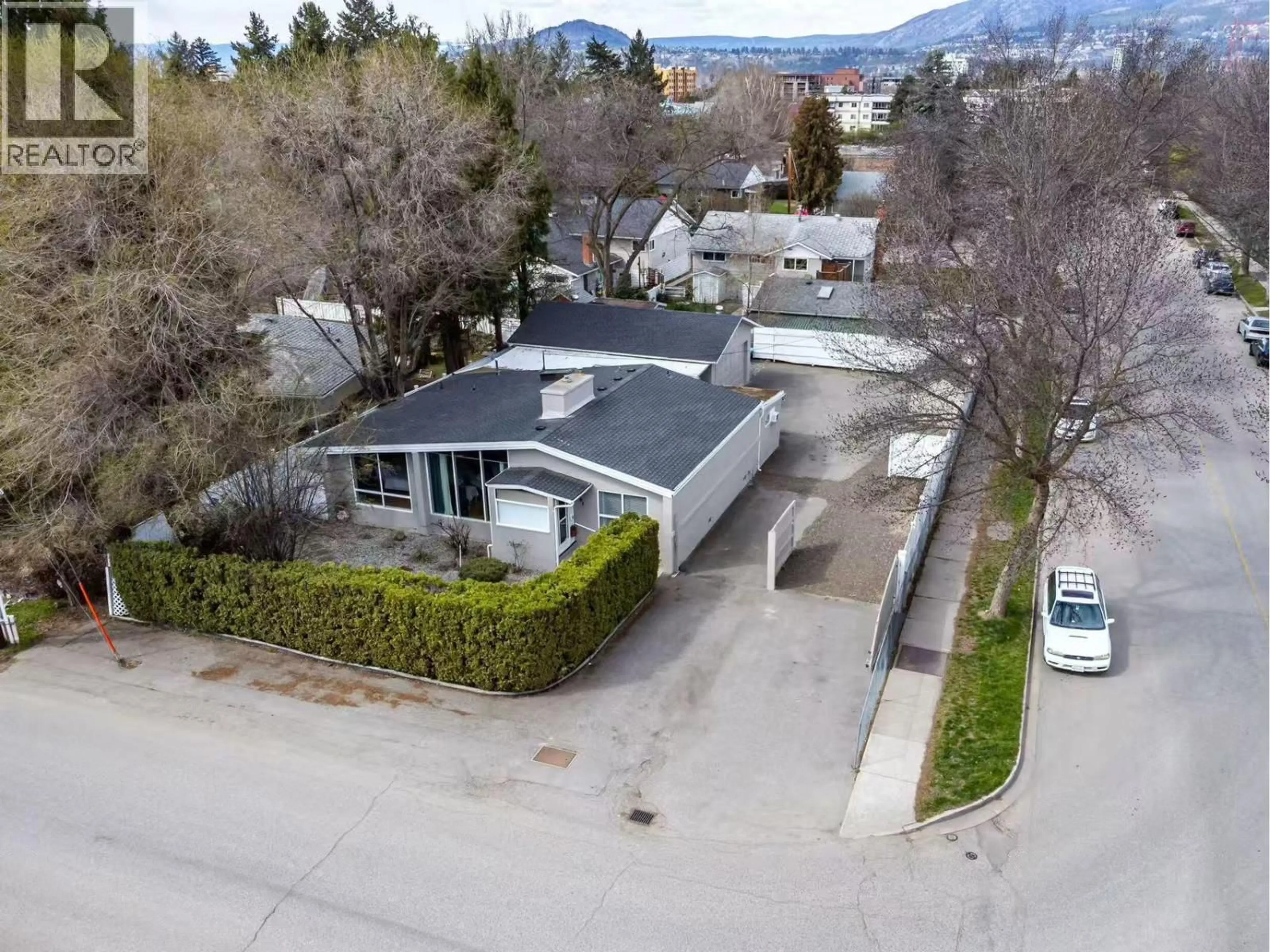 A pic from outside/outdoor area/front of a property/back of a property/a pic from drone, street for 1201 KELGLEN CRESCENT, Kelowna British Columbia V1Y6K4