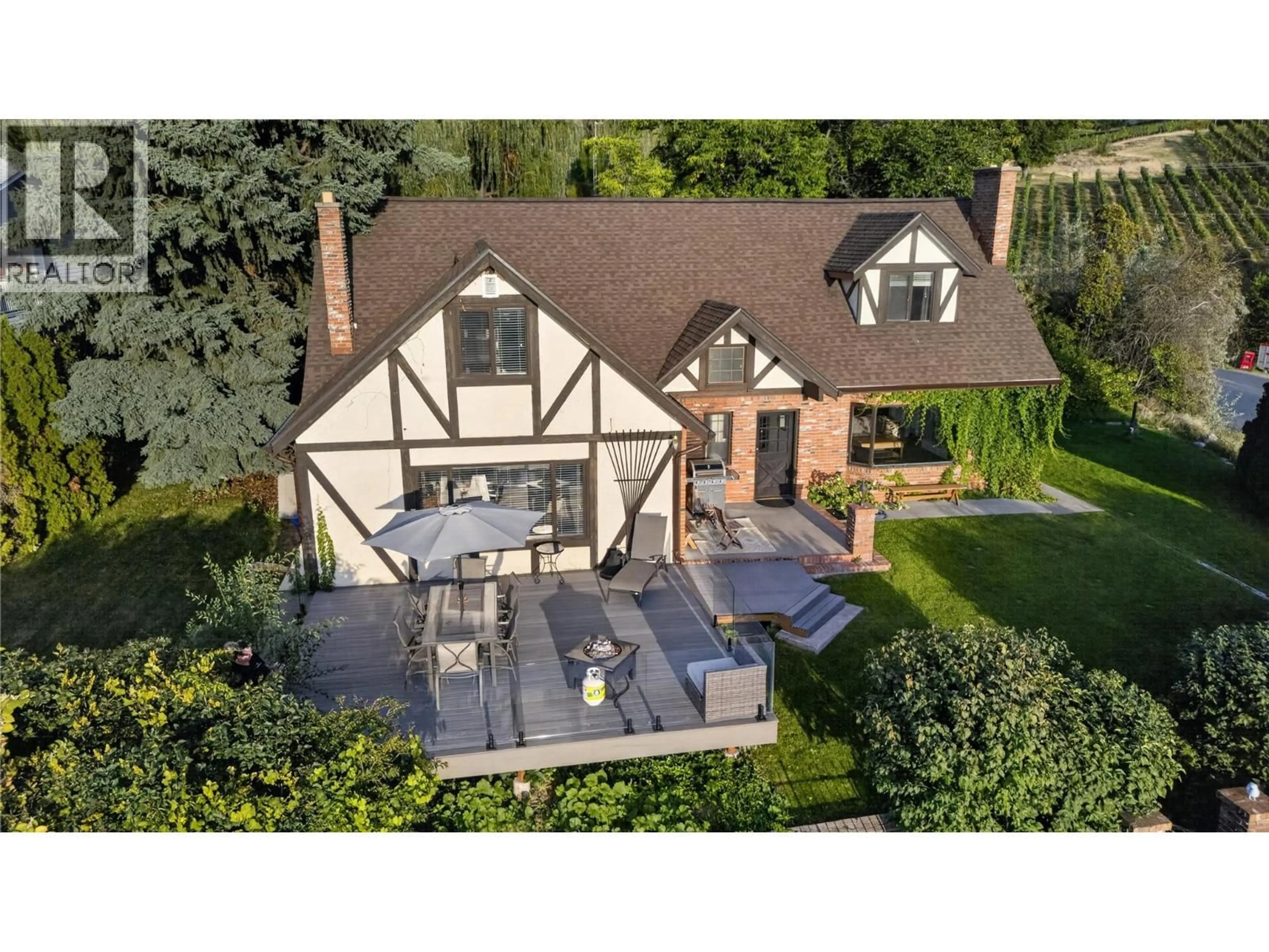 A pic from outside/outdoor area/front of a property/back of a property/a pic from drone, street for 1215 ARAWANA ROAD, Naramata British Columbia V0H1N1