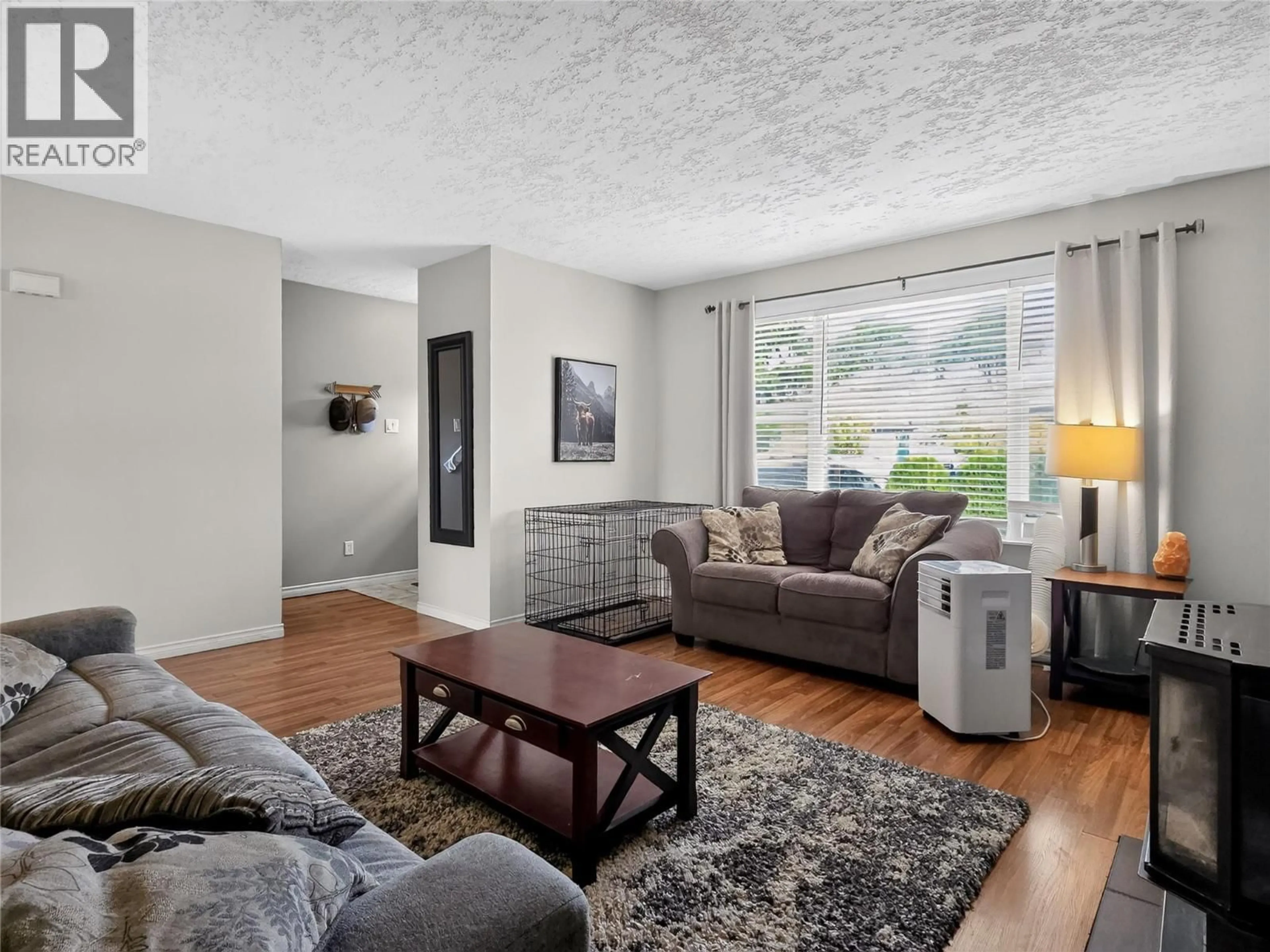 Living room with furniture, wood/laminate floor for 202 CORNWALL PLACE, Ashcroft British Columbia V0K1A0