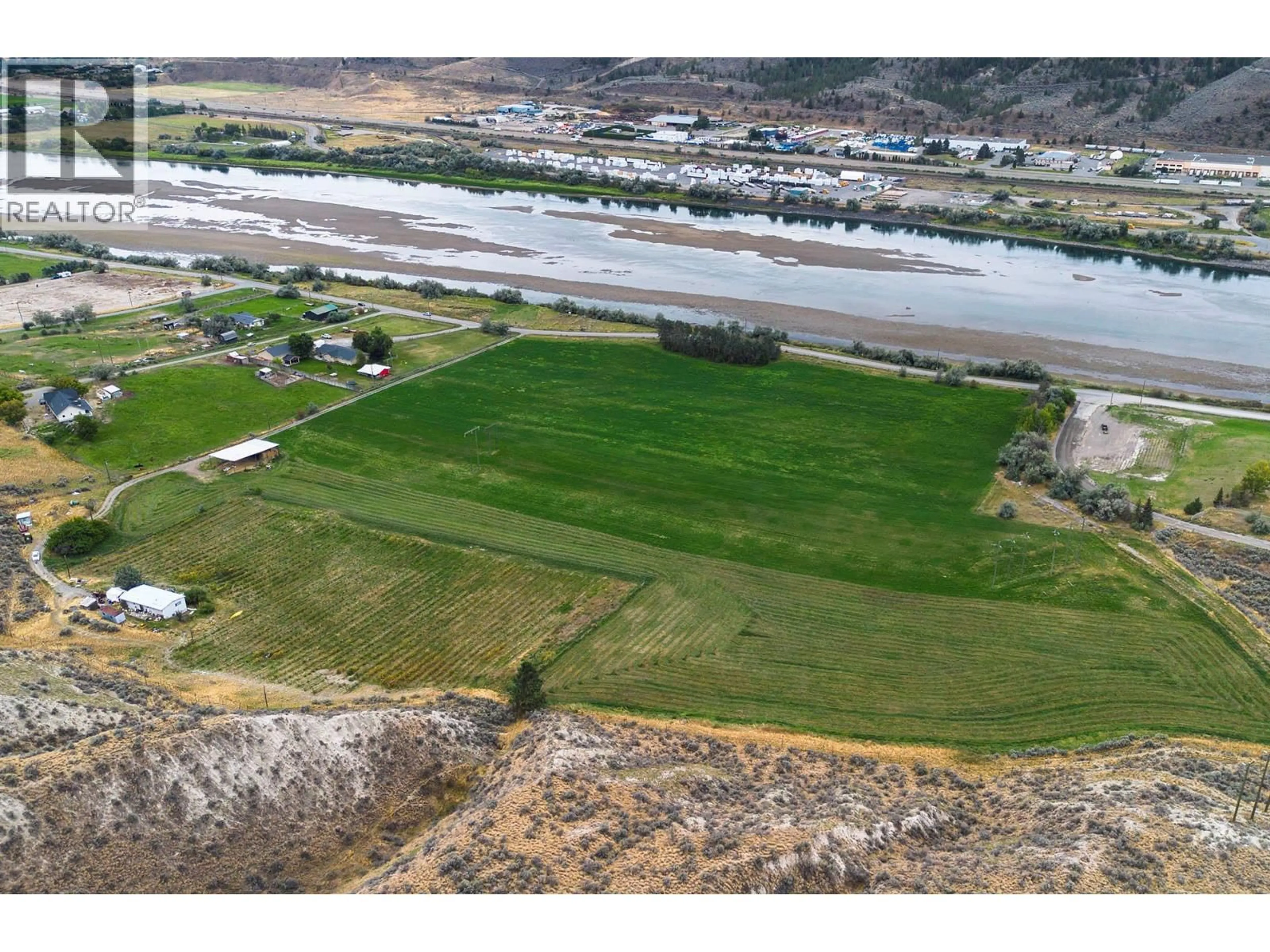 A pic from outside/outdoor area/front of a property/back of a property/a pic from drone, water/lake/river/ocean view for 3059 SHUSWAP E ROAD, Kamloops British Columbia V2C2J3