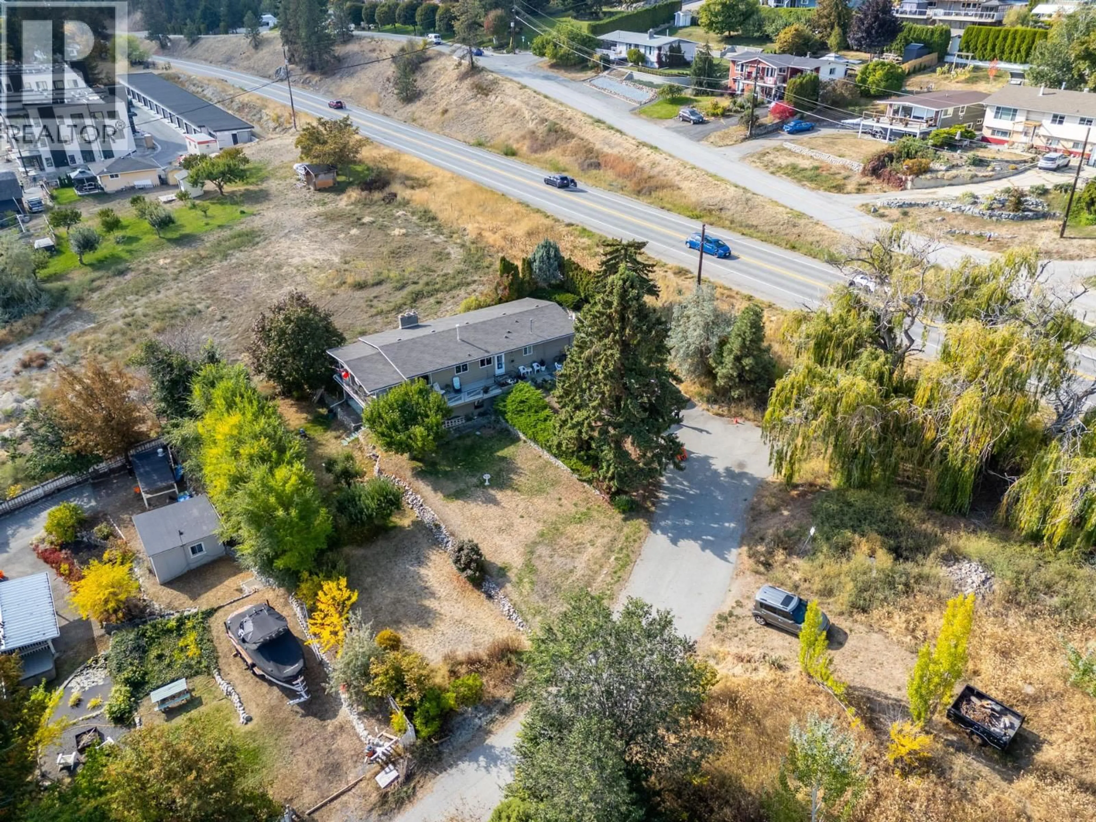A pic from outside/outdoor area/front of a property/back of a property/a pic from drone, street for 5284 TAILYOUR LANE, Peachland British Columbia V0H1X1