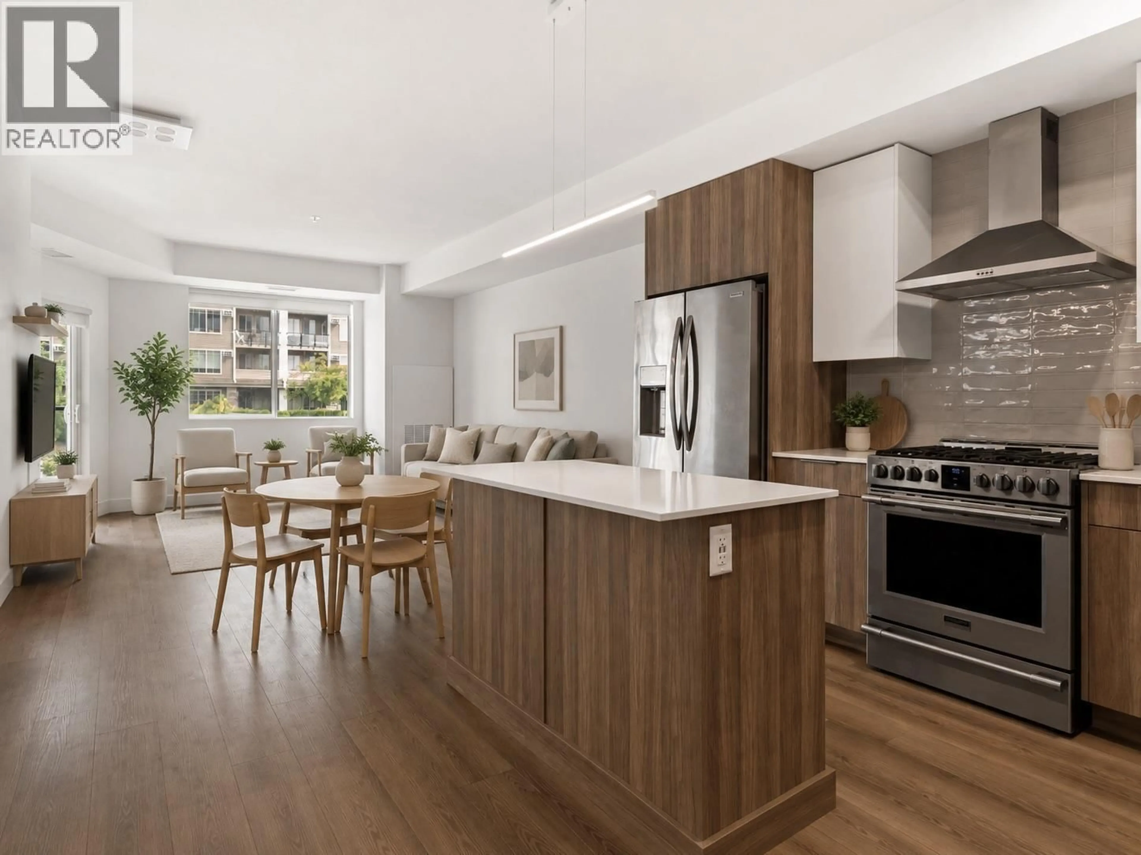 Open concept kitchen, wood/laminate floor for 201 - 3642 MISSION SPRINGS DRIVE, Kelowna British Columbia V1W0E1