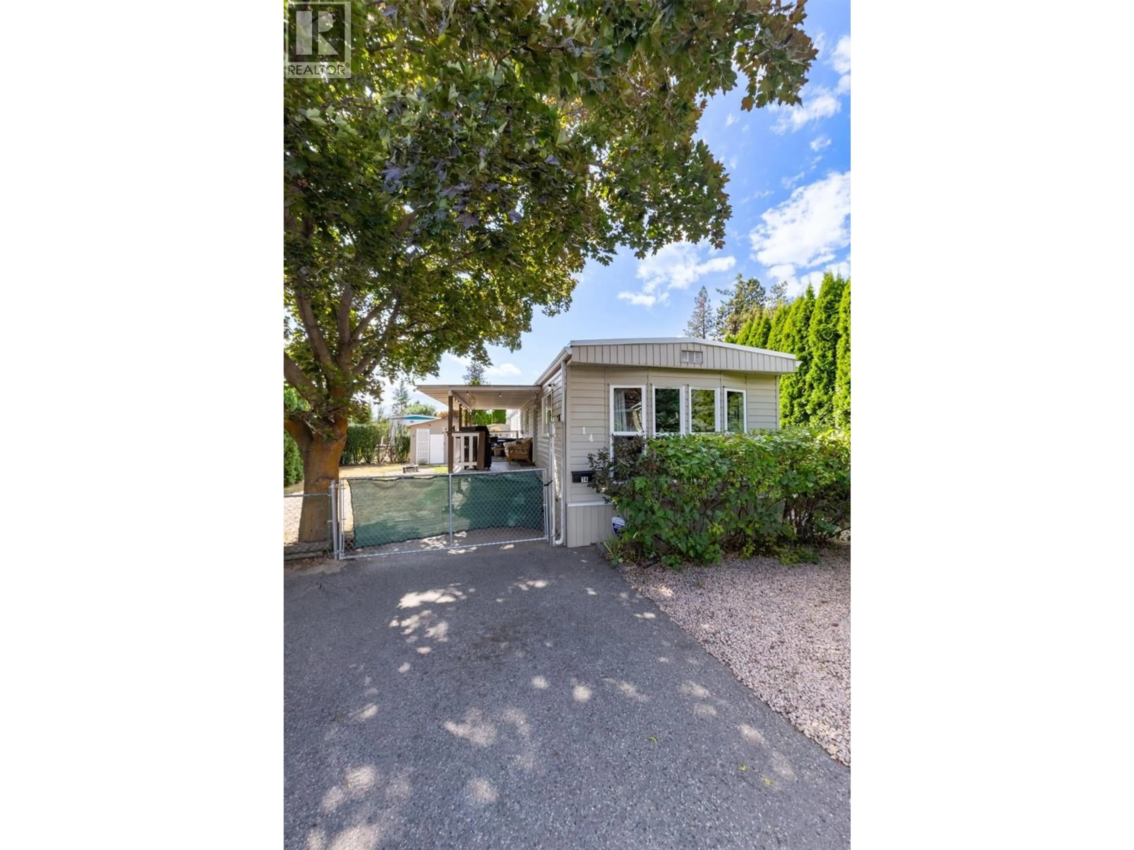 A pic from outside/outdoor area/front of a property/back of a property/a pic from drone, street for 14 - 2001 97 HIGHWAY SOUTH, Westbank British Columbia V1Z3M9