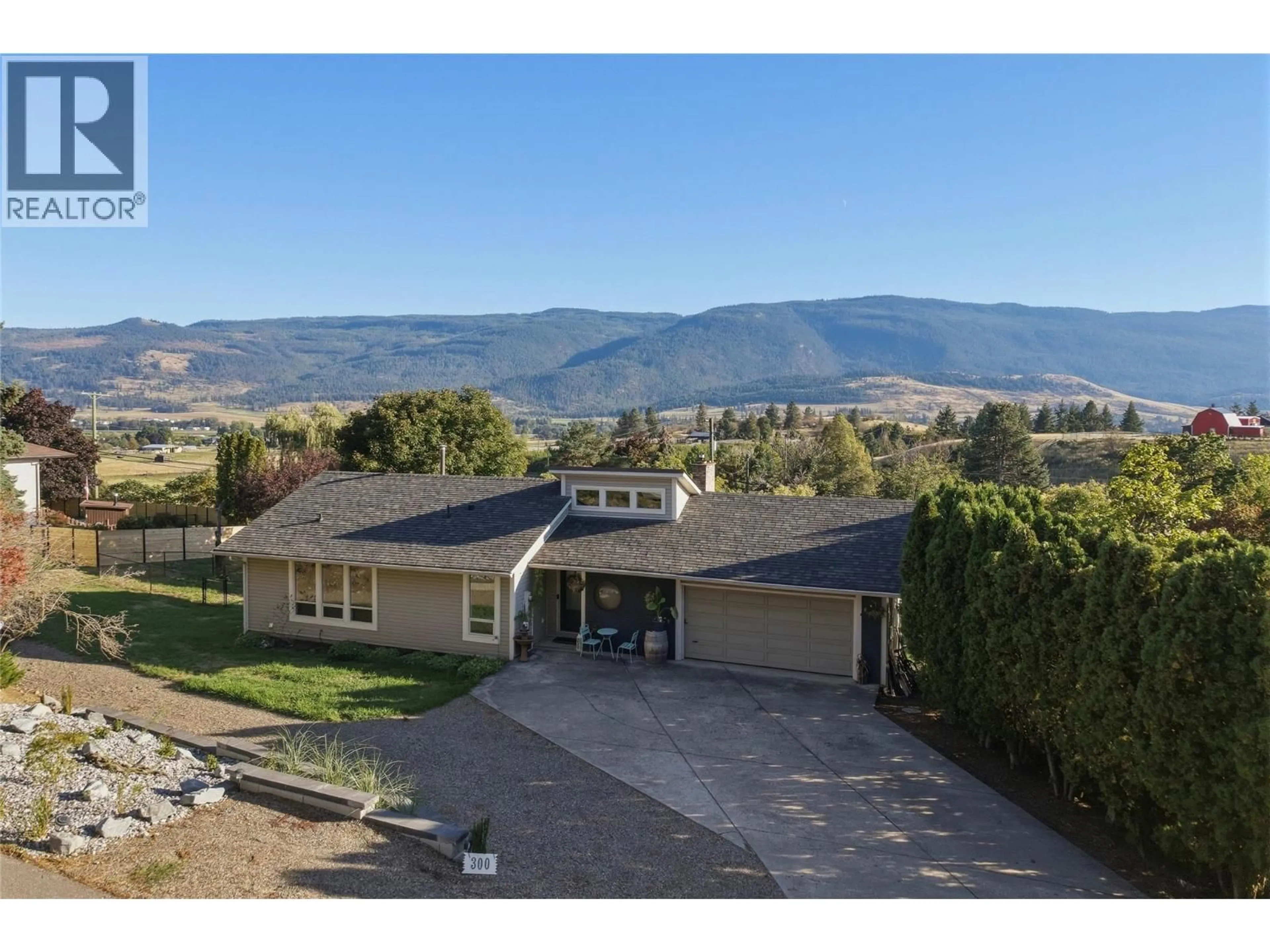 A pic from outside/outdoor area/front of a property/back of a property/a pic from drone, mountain view for 300 SCENIC DRIVE, Coldstream British Columbia V1B2X3