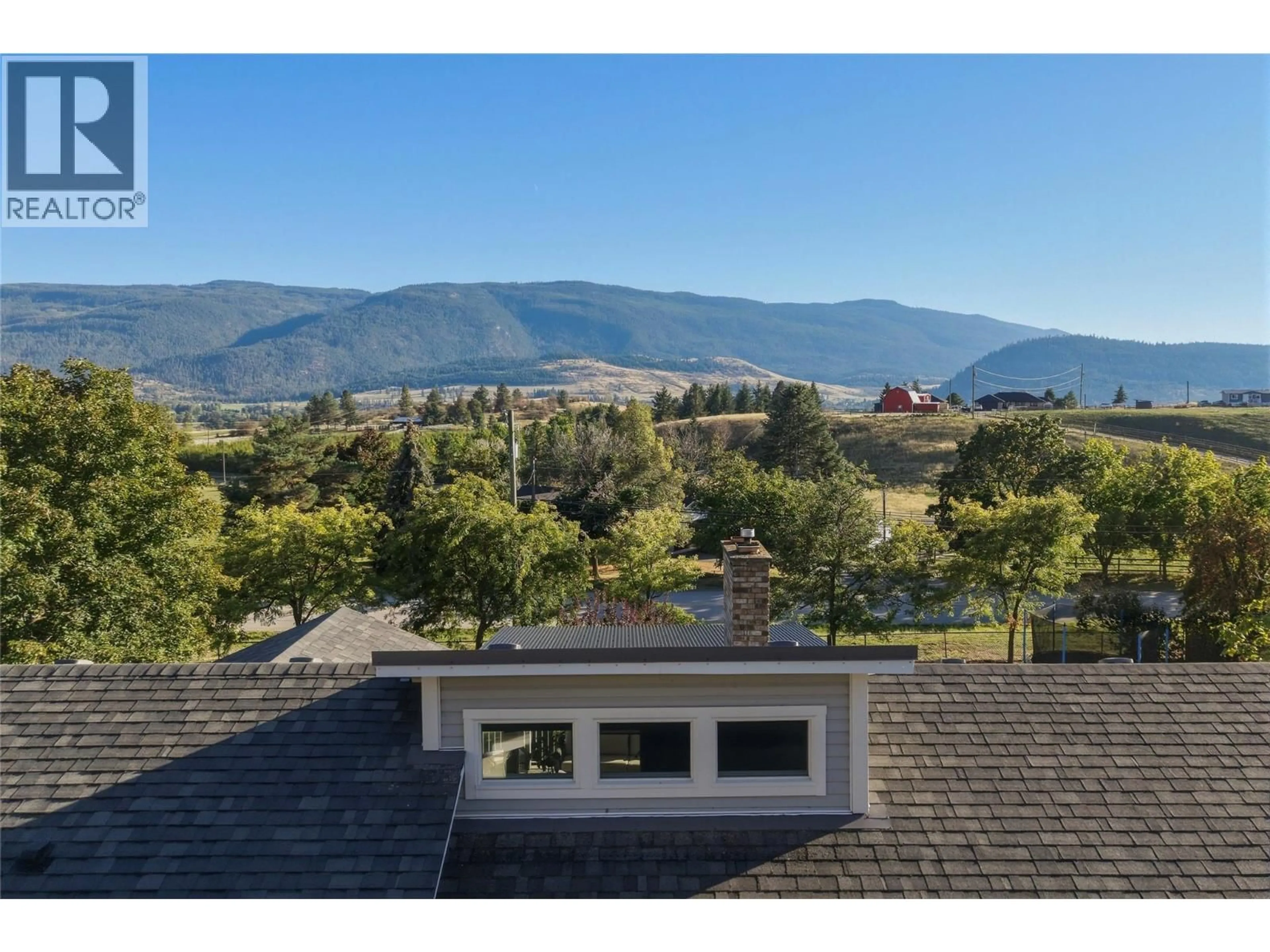 A pic from outside/outdoor area/front of a property/back of a property/a pic from drone, mountain view for 300 SCENIC DRIVE, Coldstream British Columbia V1B2X3