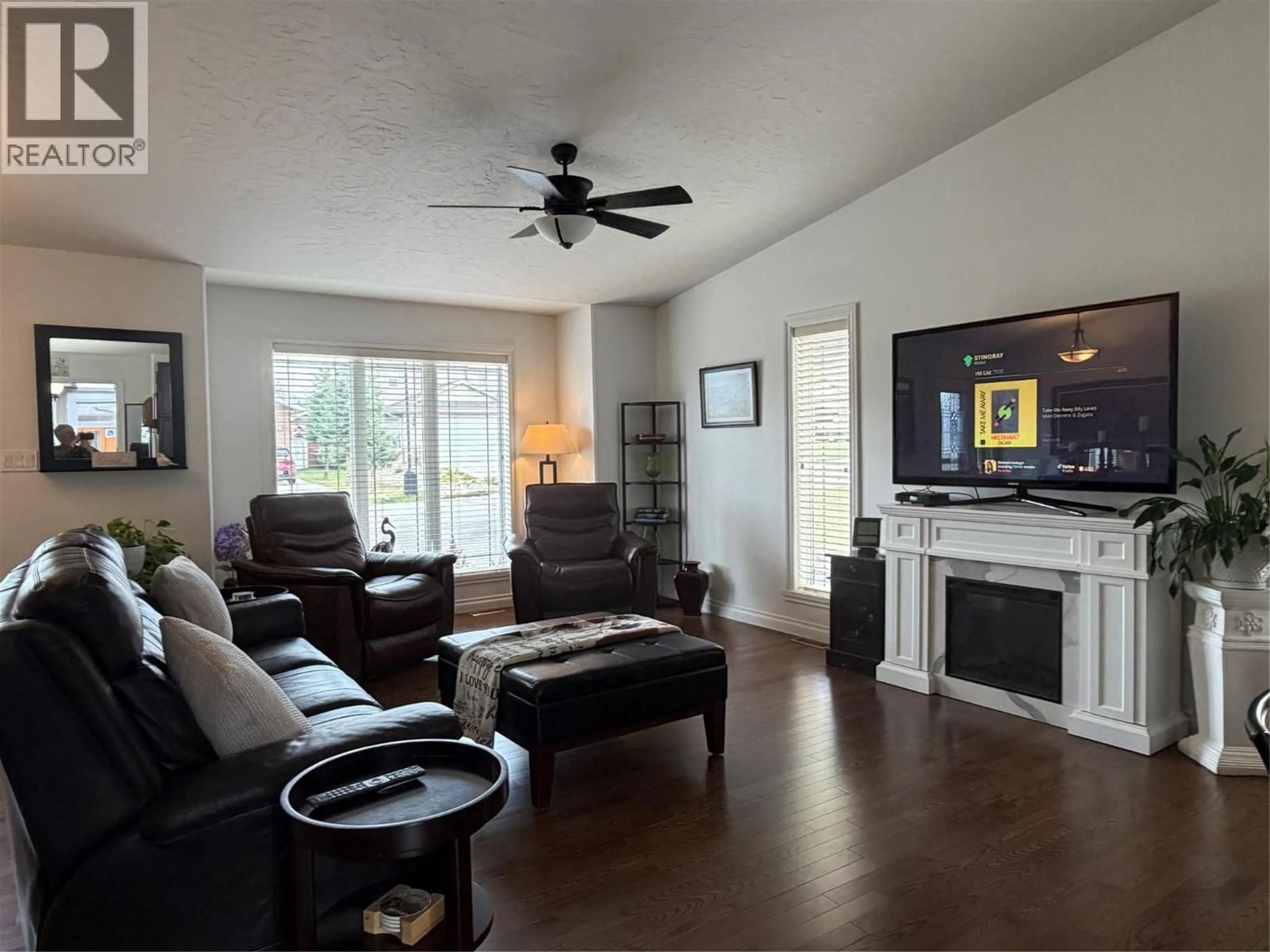 Living room with furniture, wood/laminate floor for 1841 87 AVENUE, Dawson Creek British Columbia V1G0B6
