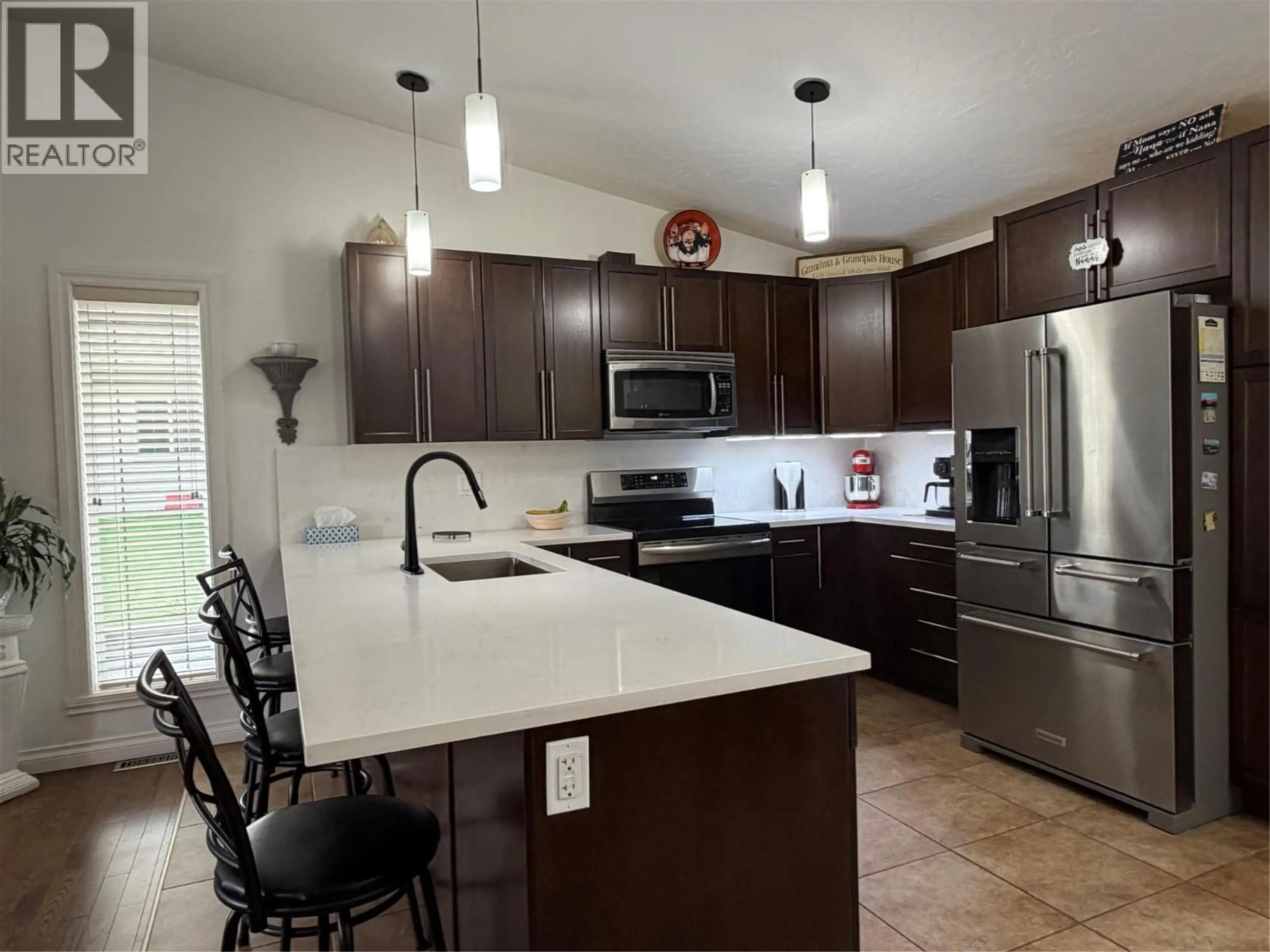 Open concept kitchen, ceramic/tile floor for 1841 87 AVENUE, Dawson Creek British Columbia V1G0B6