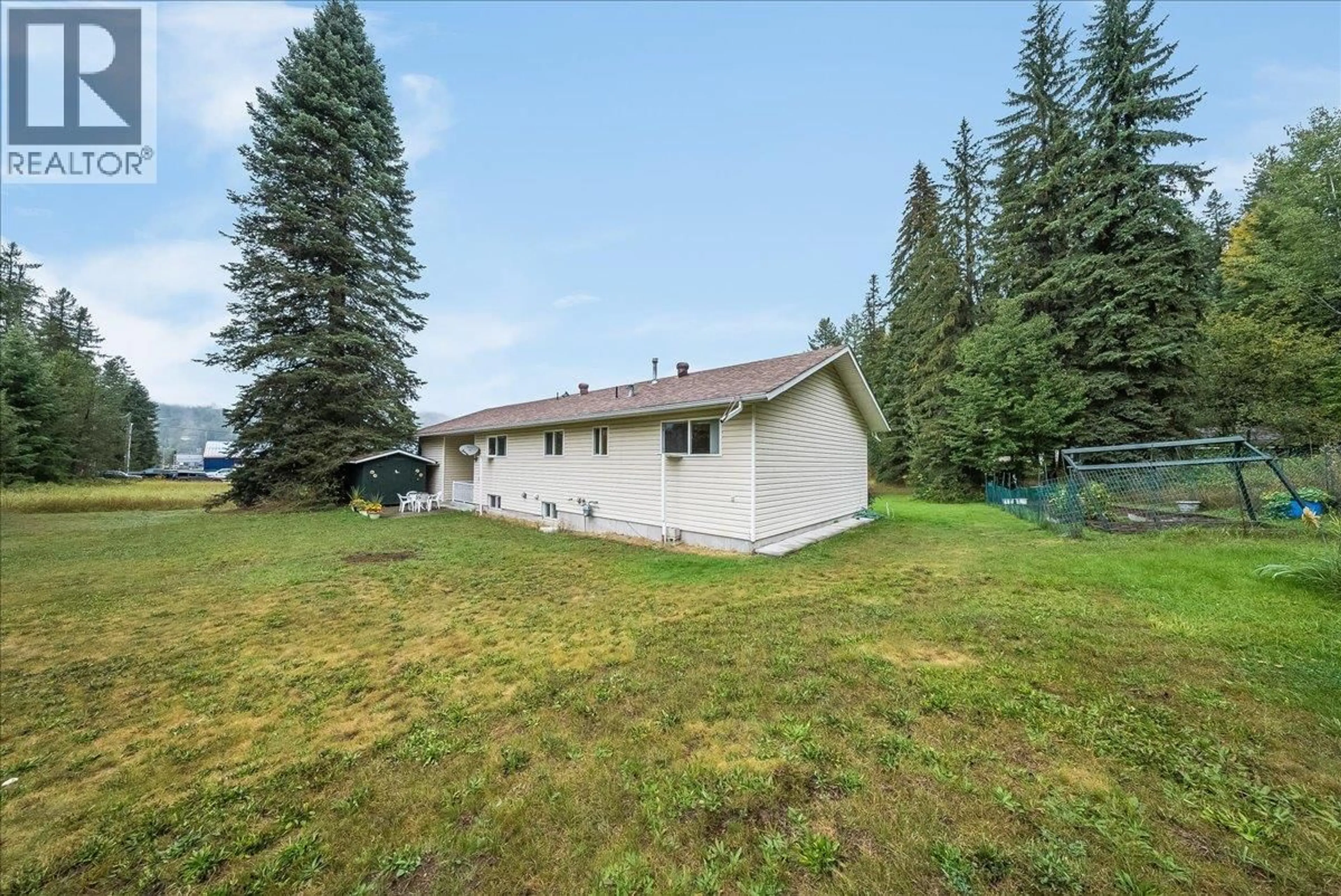 A pic from outside/outdoor area/front of a property/back of a property/a pic from drone, mountain view for 1764 GREEN ROAD, Fruitvale British Columbia V0G1L1