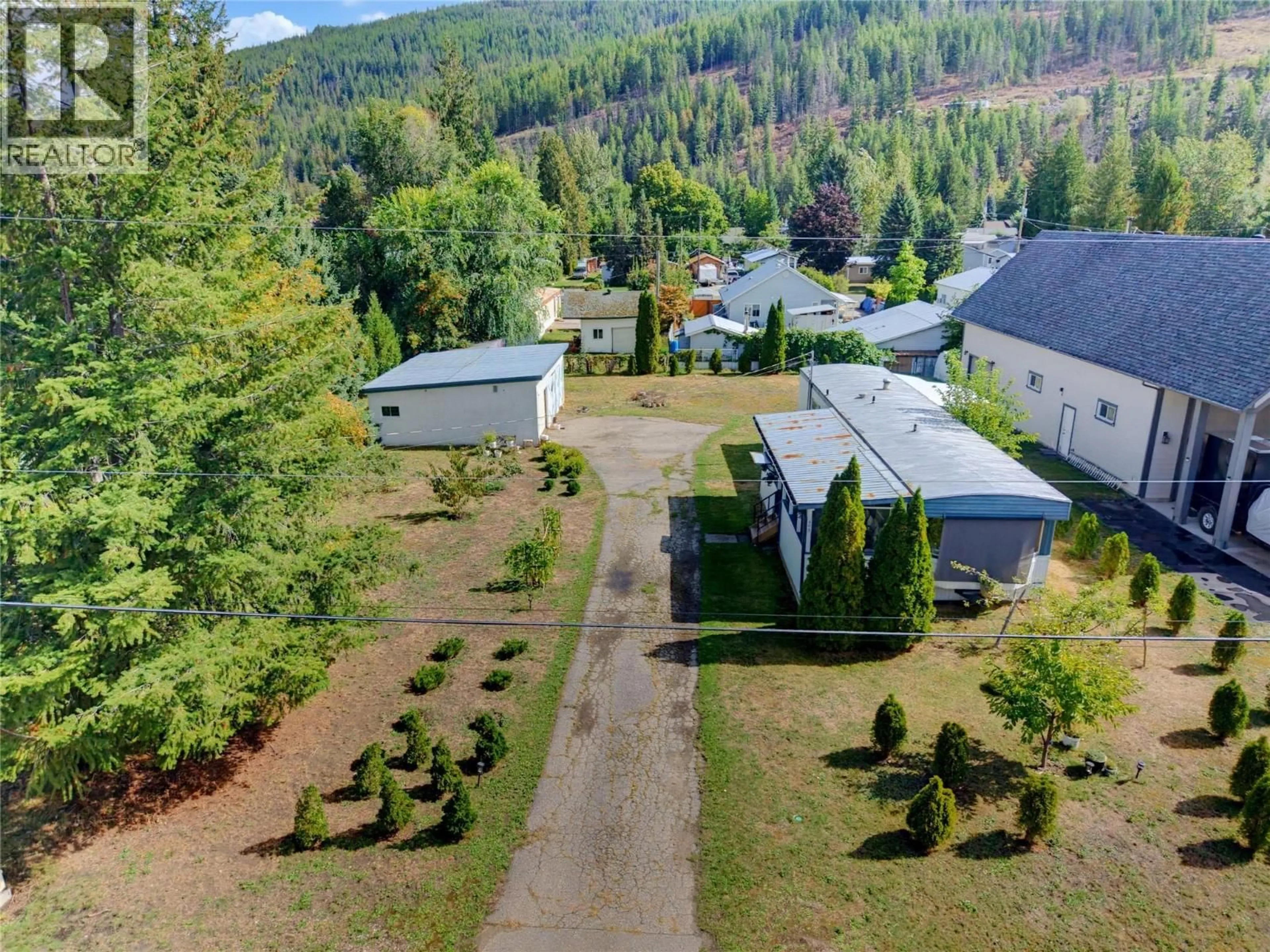 A pic from outside/outdoor area/front of a property/back of a property/a pic from drone, mountain view for 405 GILLIS AVENUE, Sicamous British Columbia V0E2V1