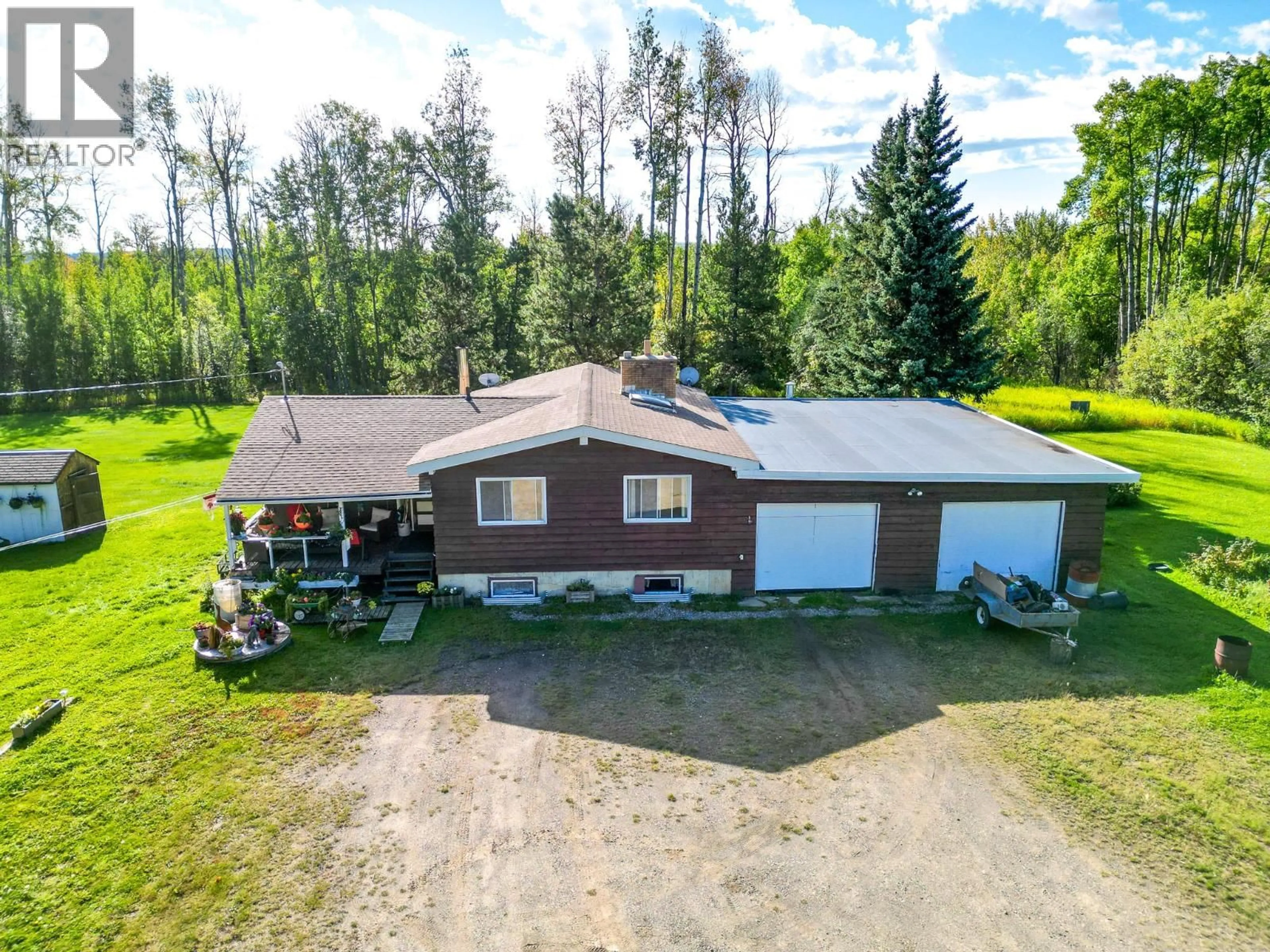A pic from outside/outdoor area/front of a property/back of a property/a pic from drone, unknown for 14034 211 ROAD, Dawson Creek British Columbia V1G4G7