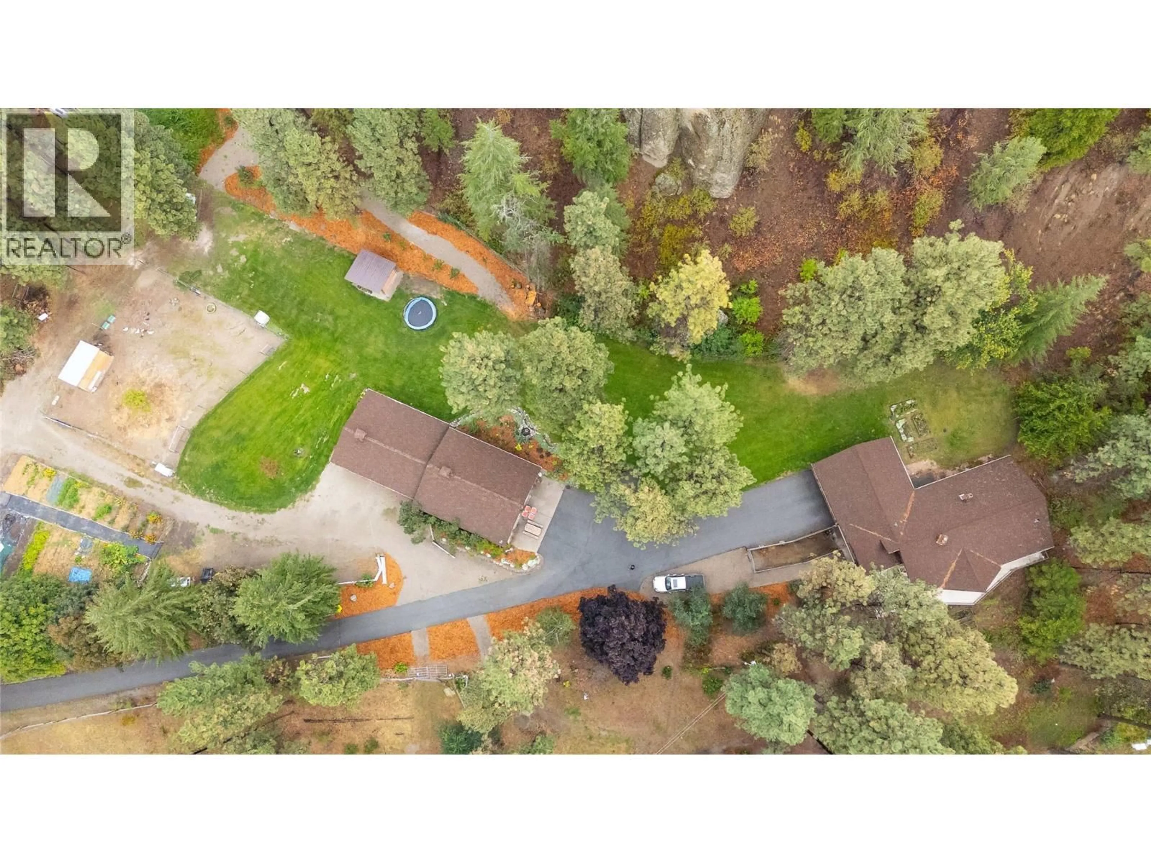 A pic from outside/outdoor area/front of a property/back of a property/a pic from drone, forest/trees view for 6407 SIMPSON ROAD, Summerland British Columbia V0H1Z2