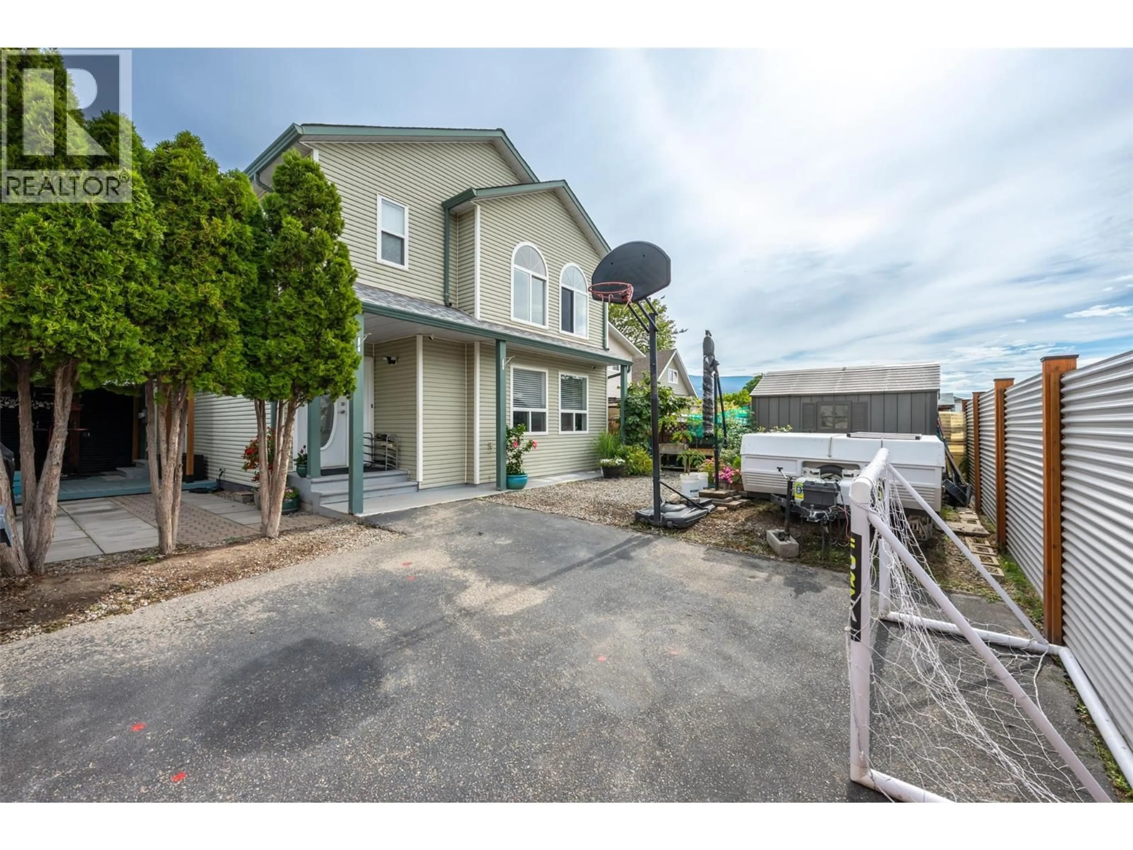 A pic from outside/outdoor area/front of a property/back of a property/a pic from drone, street for 102 - 381 RIGSBY STREET, Penticton British Columbia V2A5S8