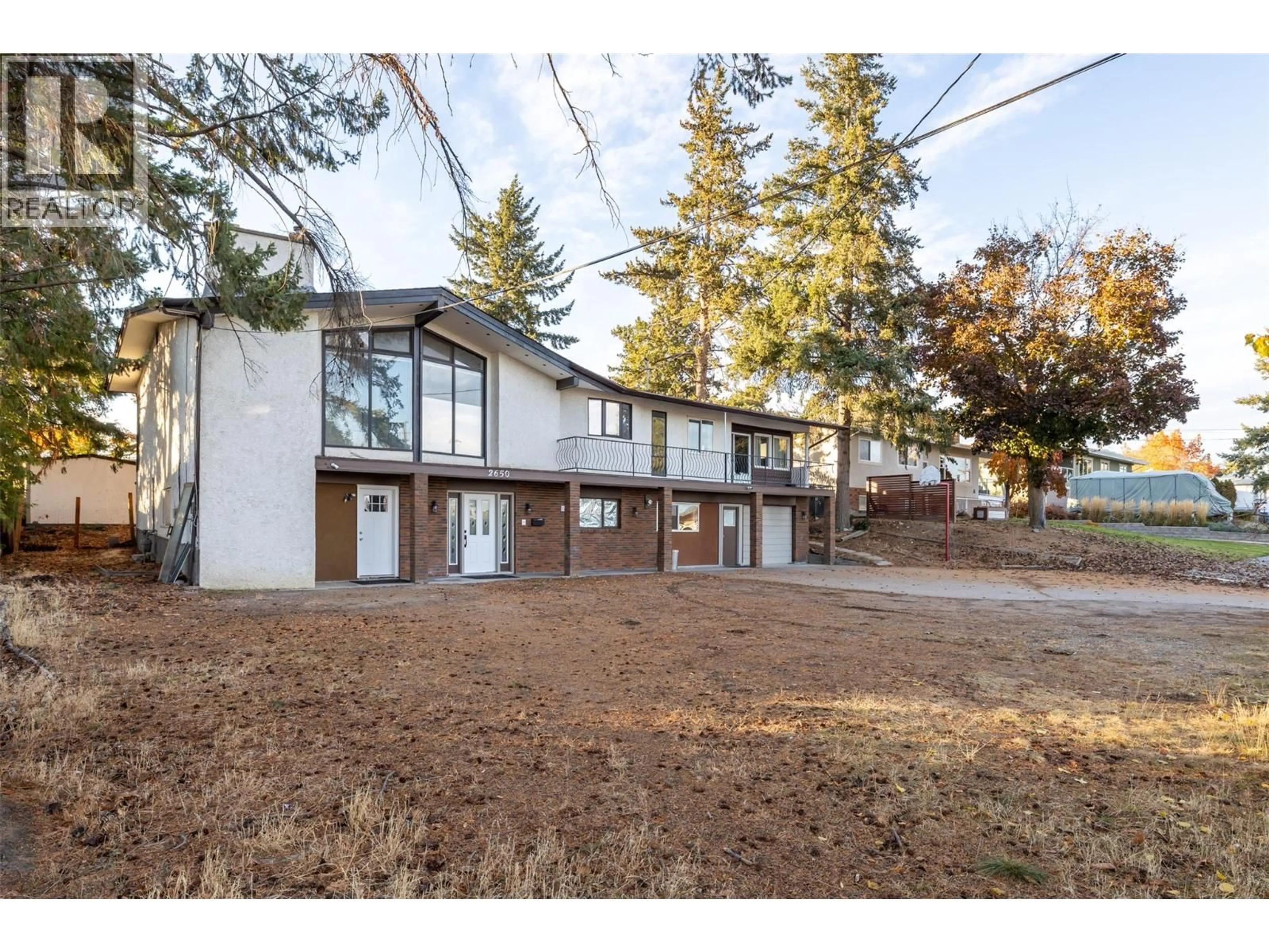 A pic from outside/outdoor area/front of a property/back of a property/a pic from drone, street for 2650 THACKER DRIVE, West Kelowna British Columbia V1Z1W3