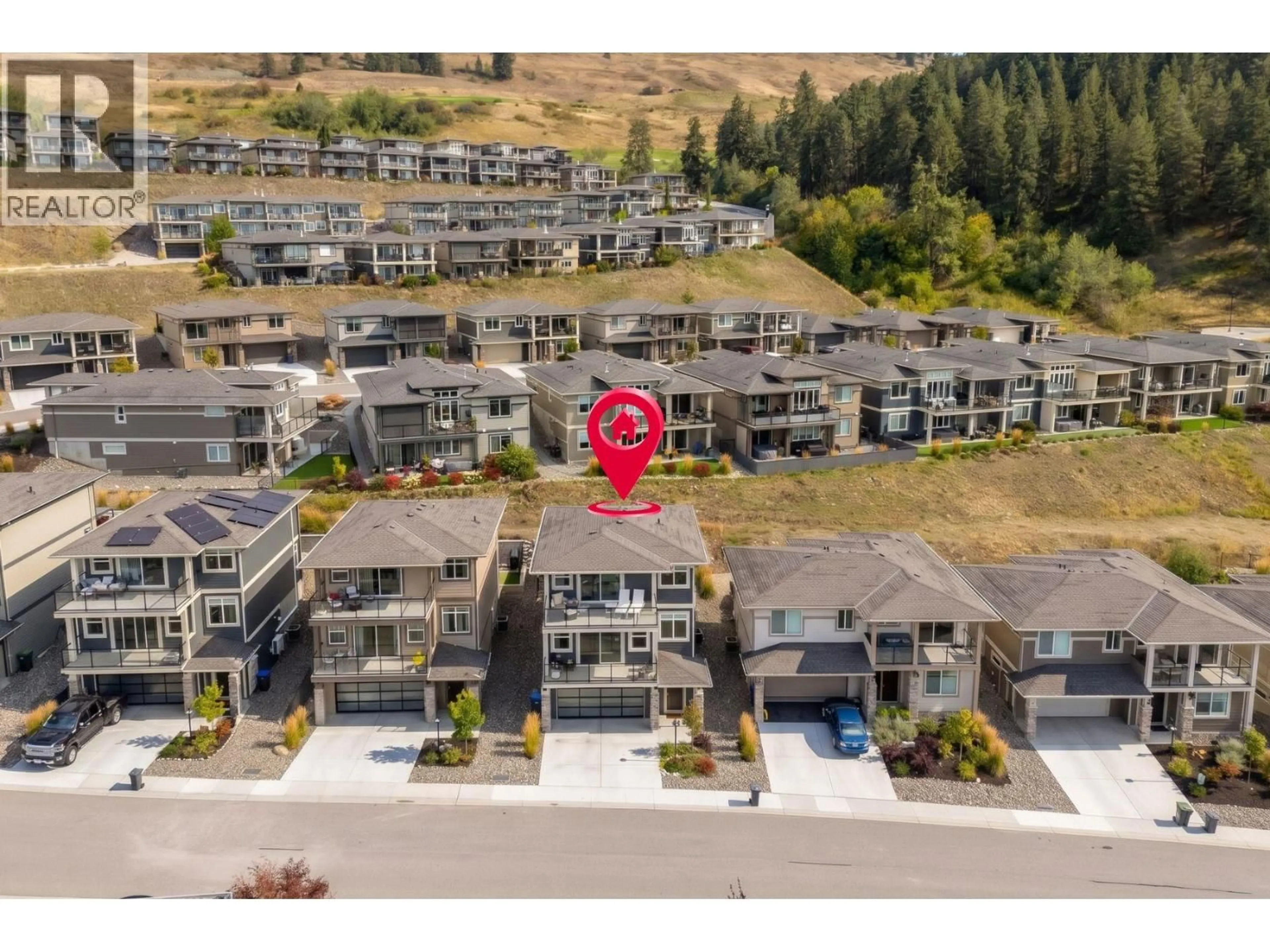 A pic from outside/outdoor area/front of a property/back of a property/a pic from drone, mountain view for 1469 TOWER RANCH DRIVE, Kelowna British Columbia V1P1T8