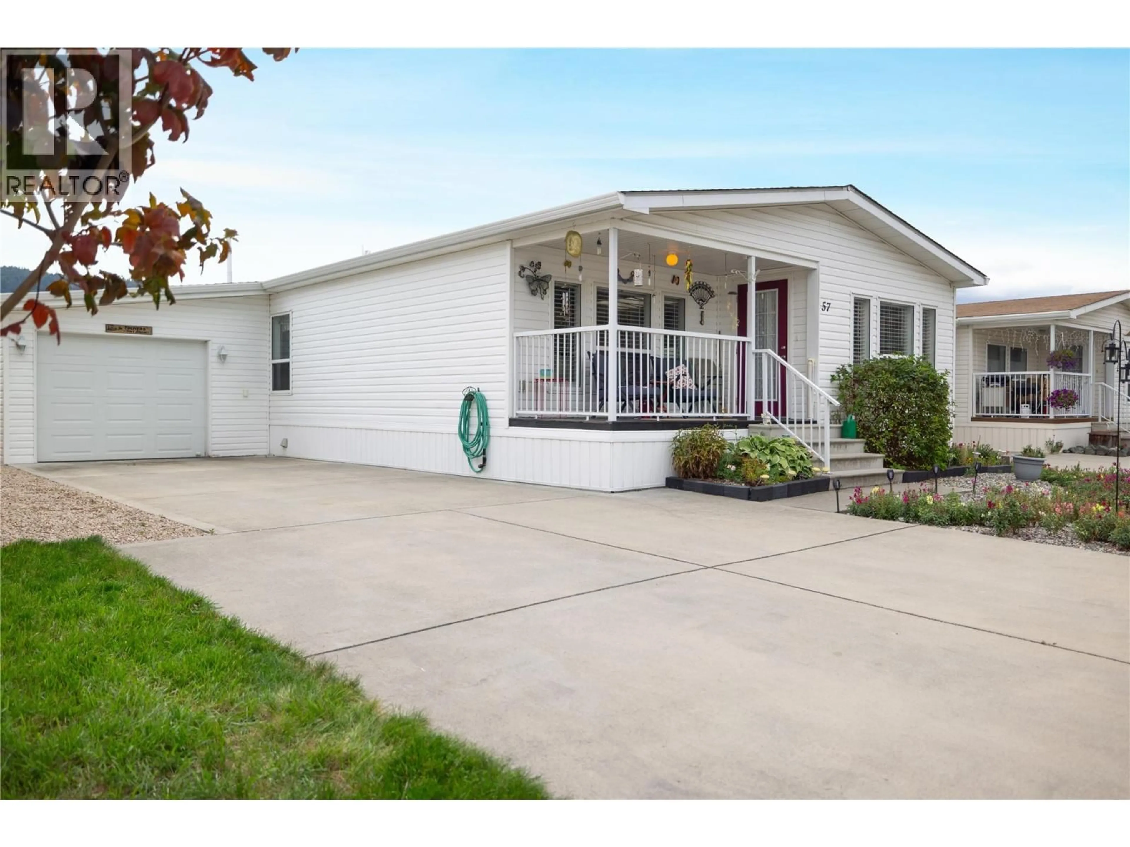 Home with vinyl exterior material, street for 57 - 6688 TRONSON ROAD, Vernon British Columbia V1H1R9