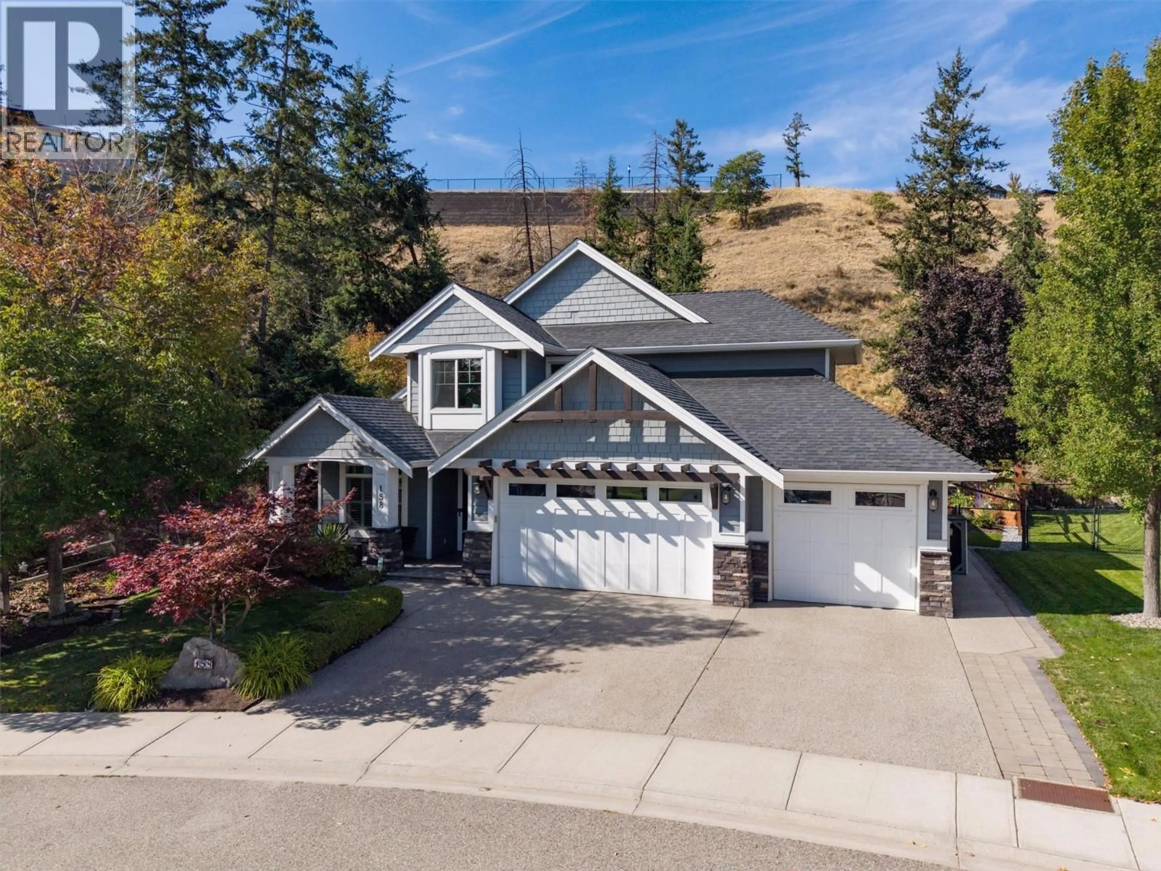 A pic from outside/outdoor area/front of a property/back of a property/a pic from drone, street for 158 LOST CREEK COURT, Kelowna British Columbia V1V3B7