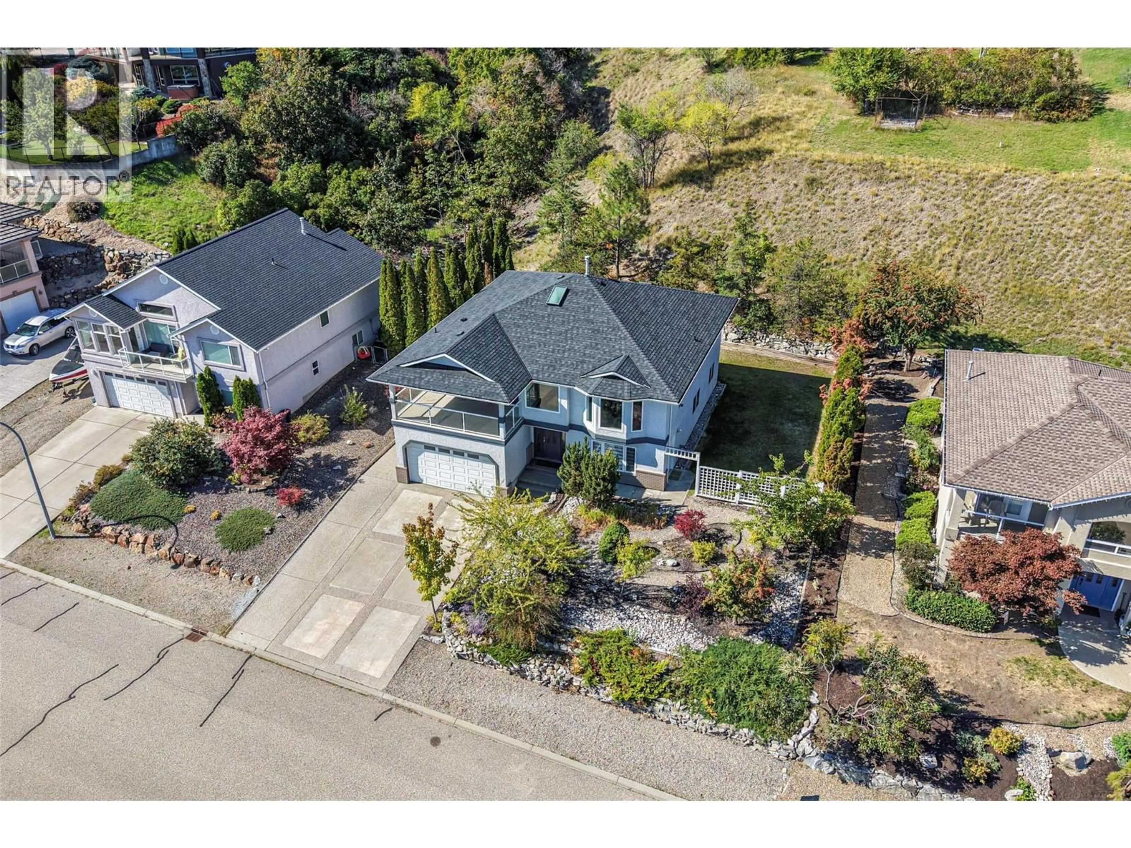 A pic from outside/outdoor area/front of a property/back of a property/a pic from drone, street for 8210 STONERIDGE DRIVE, Coldstream British Columbia V1B3M3